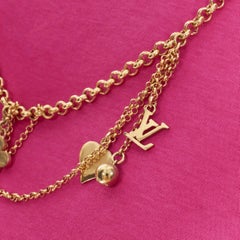 LOUIS VUITTON gold LV charm multi chain ribbon necklace pink cotton tshirt M