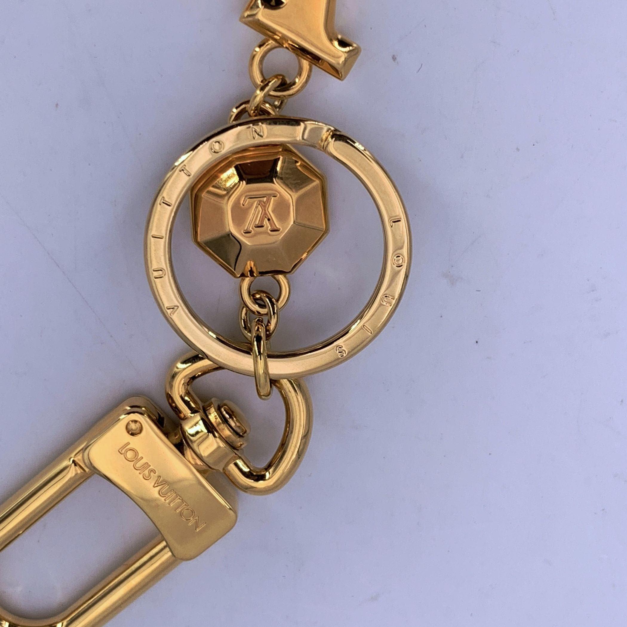 Louis Vuitton Oro Metallo Lv Faccettes Portachiavi Catena Charm Borsa In condizioni ottime in vendita a Rome, Rome