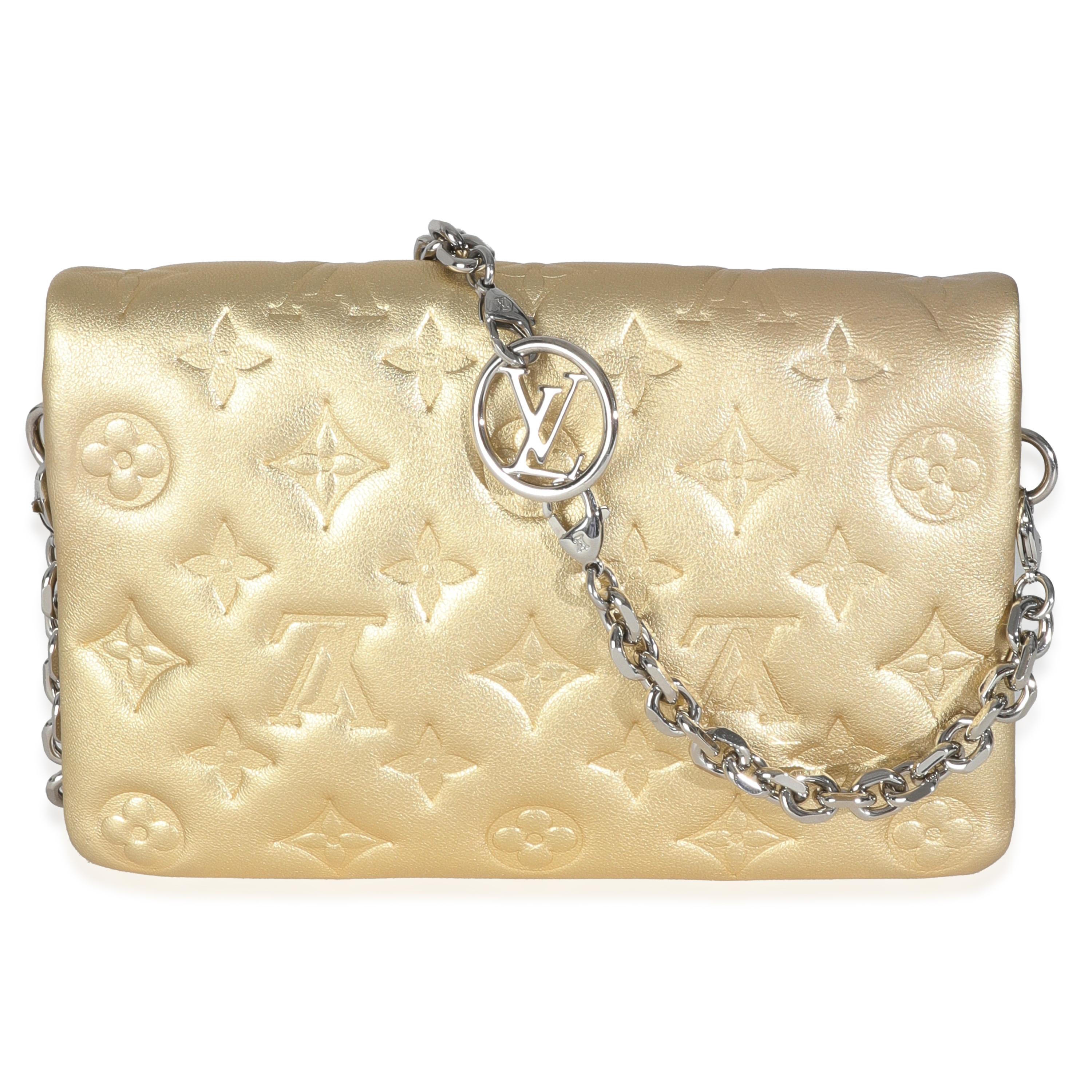 Listing Title: Louis Vuitton Gold Metallic Lambskin Embossed Monogram Pochette Coussin
SKU: 146672
MSRP: 3100.00 USD
Condition: Pre-owned 
Handbag Condition: Excellent
Condition Comments: Item is in excellent condition and displays light signs of
