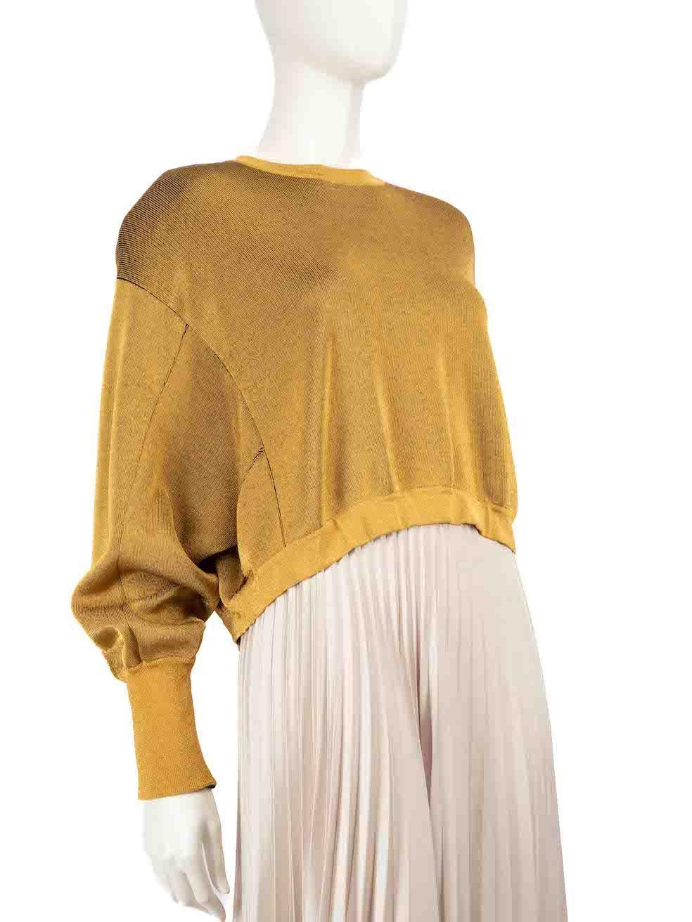 CONDITION is Very good. Minimal wear to top is evident. Light pull to the weave on the left sleeve on this used Louis Vuitton designer resale item.
 
 Details
 Gold metalic
 Wool
 Knit jumper
 Long sleeves
 Round neck
 Shoulder pads
 Cropped fit
 
