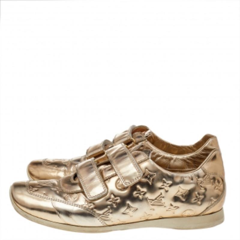 These Tennis shoes from Louis Vuitton are here to elevate your style and let you explore new dimensions in the latest trends. These shoes are created skillfully using the Monogram gold metallic leather with dual velcro-strap closures adorning the