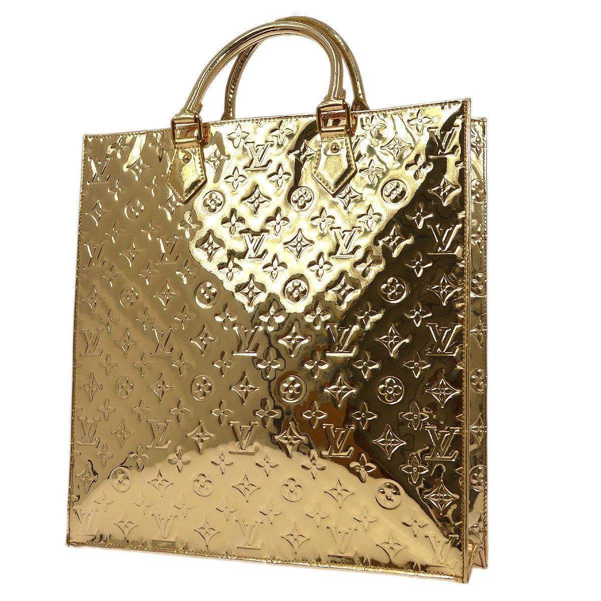 Marron Louis Vuitton - Sac fourre-tout de voyage à poignée supérieure doré avec monogramme miroir et accessoires dorés en vente