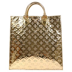 LOUIS VUITTON Borsa da viaggio con manico superiore in oro e specchio con monogramma in oro