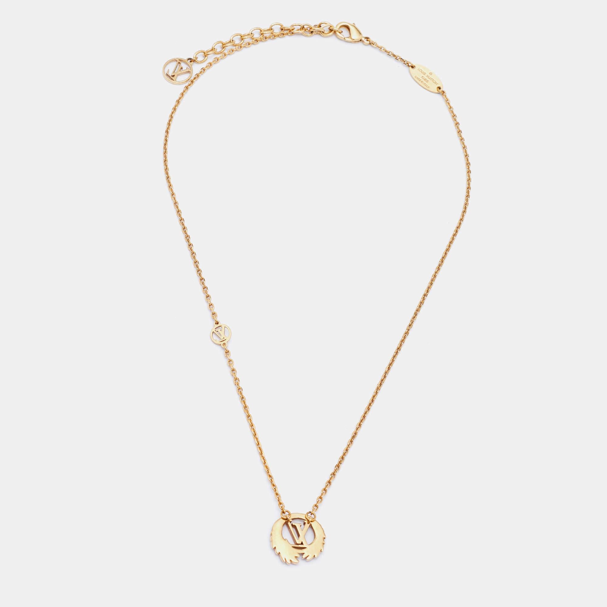 This necklace from Louis Vuitton exemplifies minimal style with a chain that holds a gorgeous circular pendant detailed with wings and the LV logo. The necklace is crafted from gold-tone metal to a smooth finish and is held by a lobster clasp. We're