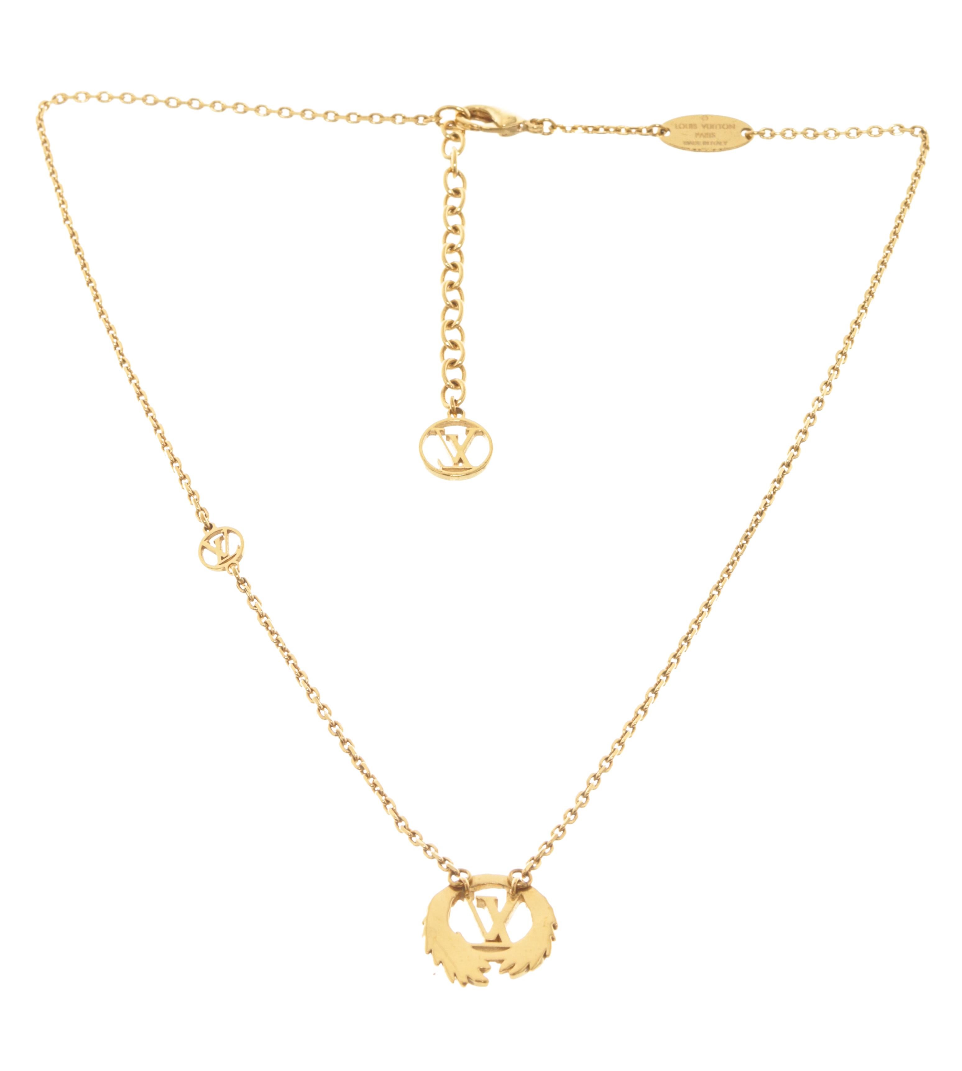 Louis Vuitton Gold-tone Collier LV Angel Pendant Necklace features several signature Louis Vuitton charms   suspended from a cable chain that can be adjusted for a custom fit with lobster clasp closure.

79294MSC