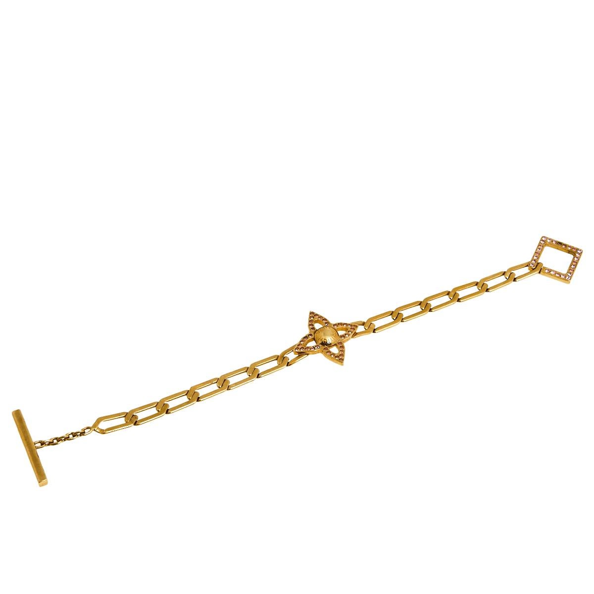 How pretty is this bracelet from Louis Vuitton! From dinner outfits to casual summer dresses, this bracelet can elevate your style and add a delicate accent to your wrist. It is made from gold-tone metal and added with an embellished flower motif