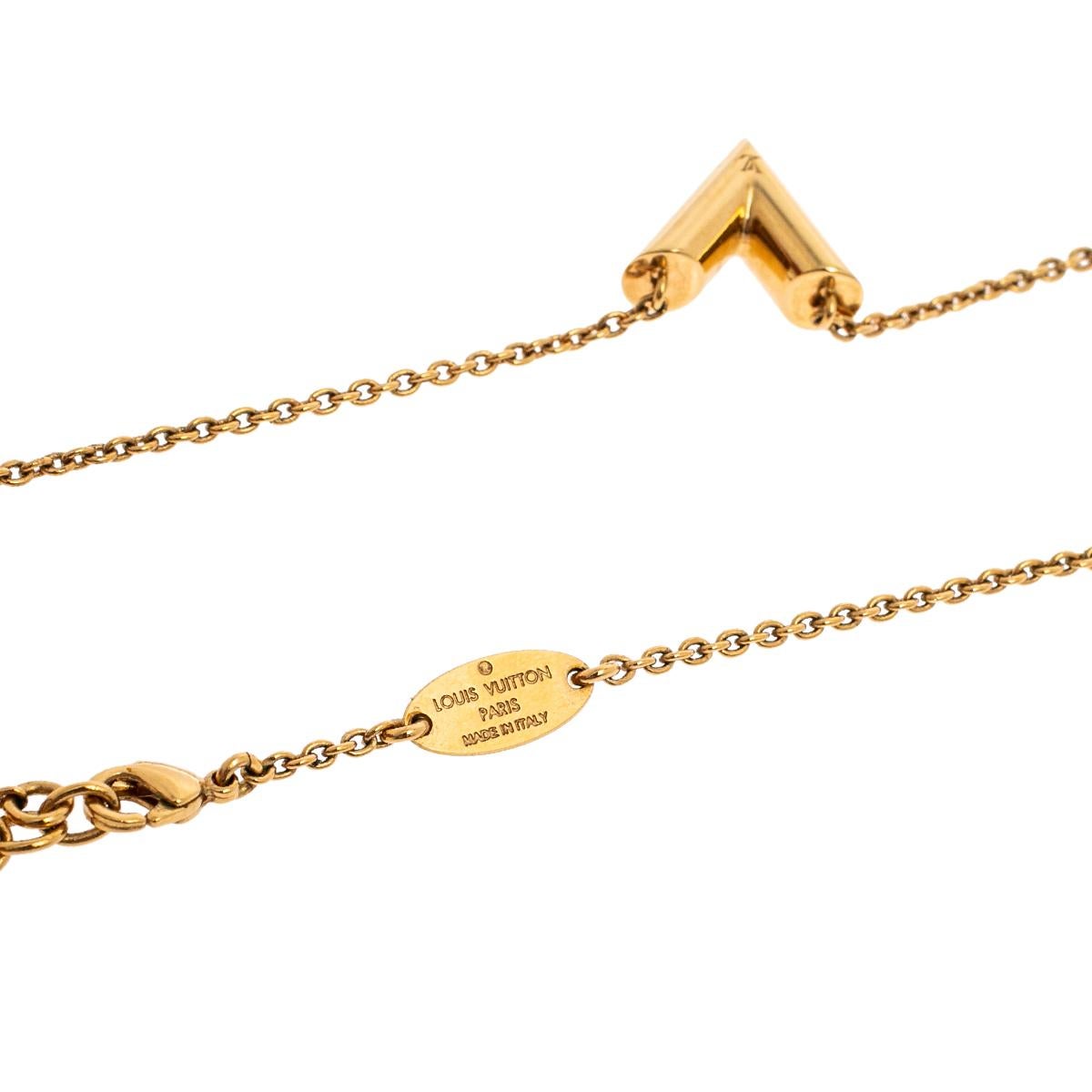 Add a timeless touch to both casual and even special looks with this beautiful Louis Vuitton Essential V necklace. Constructed in gold-tone metal, this necklace features a smooth V pendant. An adjustable lobster hook completes the piece.

Includes: