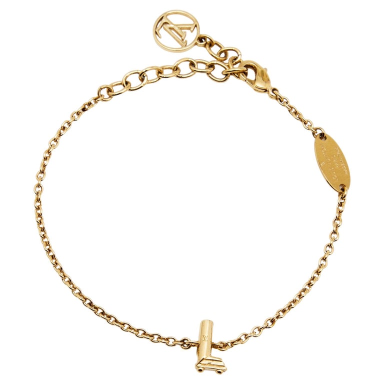 Louis Vuitton Gold Tone LV and Me Letter L Charm Bracelet For Sale at  1stDibs