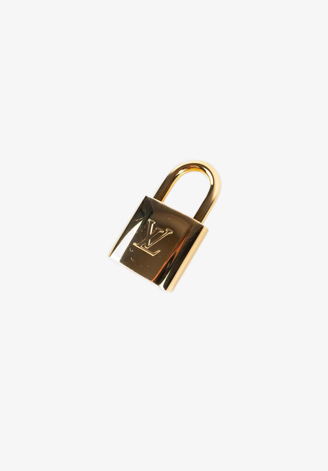 Check my other listings. Have many more designer clothes for sale. Open to any offers.
Item for sale is 100% genuine Louis Vuitton Locker Lock, S1165, DU0
Color: gold
(An actual color may a bit vary due to individual computer screen