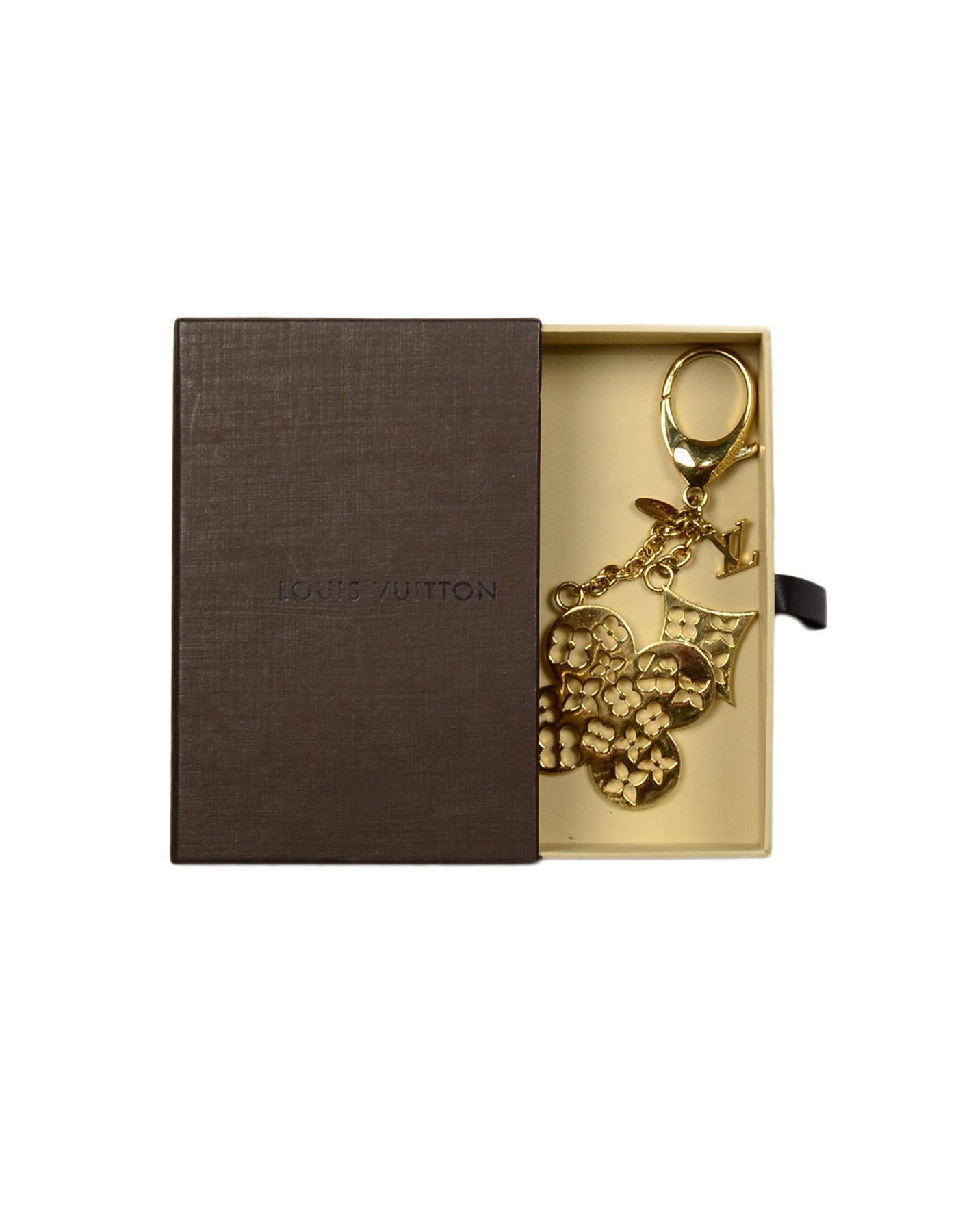 Louis Vuitton Goldtone Cutout Fleur Ivy Bag Charm/Key Chain

Made In: Italy
Year of Production: 2014
Color: Goldtone
Materials: Goldtone metal
Hallmarks: On hangtag- 