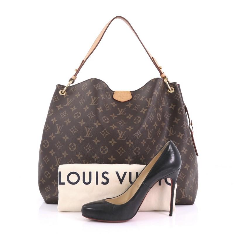 This Louis Vuitton Graceful Handbag Monogram Canvas MM, crafted from brown monogram coated canvas, features a flat handle and gold-tone hardware. Its magnetic closure opens to a pink fabric interior with zip pocket. Authenticity code reads: SD0138.