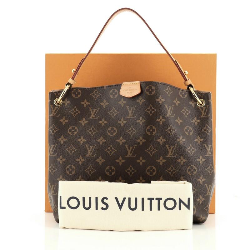 This Louis Vuitton Graceful Handbag Monogram Canvas PM, crafted in brown monogram coated canvas, features a flat leather shoulder strap, cowhide leather trim, and gold-tone hardware. Its magnetic closure opens to a brown fabric interior with zip