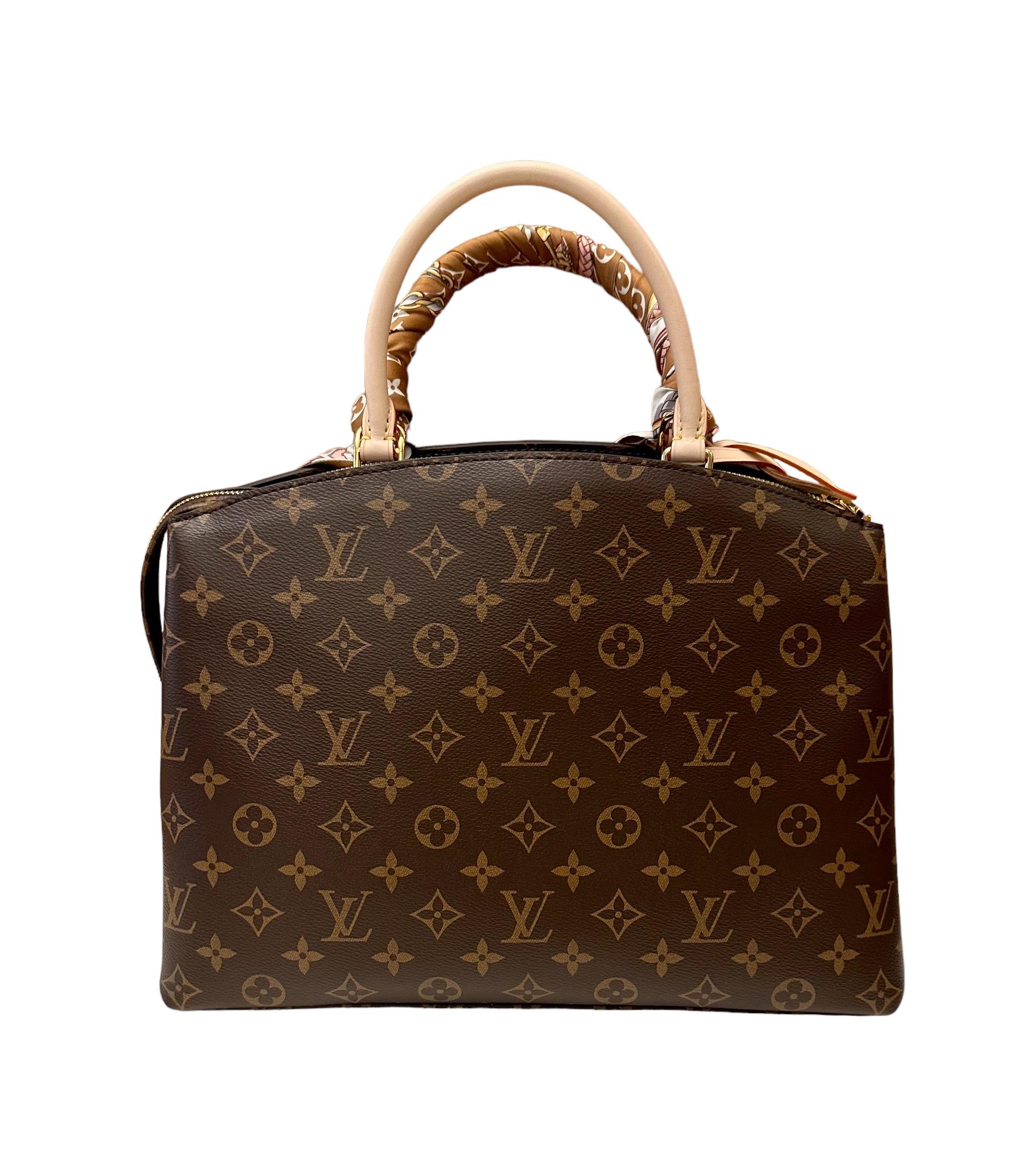 This new Grand Palais Tote bag from the house of Louis Vuitton is inspired by the iconic Lockit from 2011 and the shape of the Montaigne launched in 2014. 
It is crafted from Monogram canvas with natural leather trim and its interior features a red
