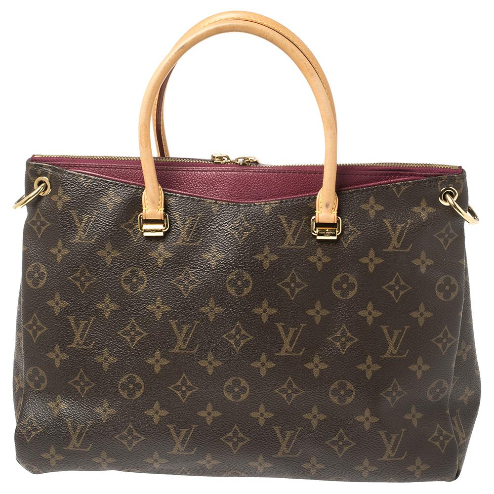 Accessorise like a pro with this trendy and functional bag from Louis Vuitton. This rich and classy Pallas bag is made from monogram coated canvas into a smart silhouette. The inside of the bag is lined with Alcantara that has a smooth texture. It
