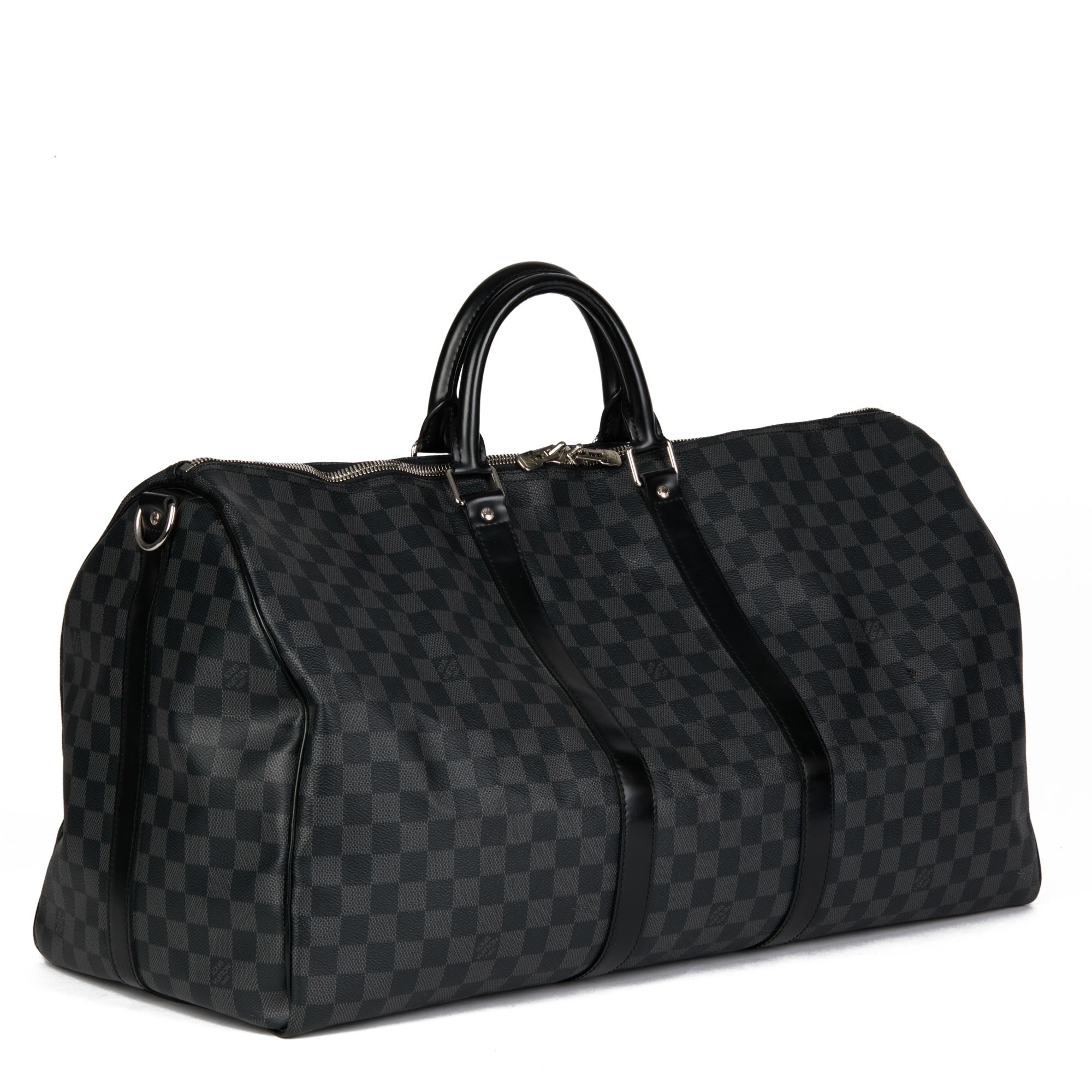 LOUIS VUITTON
Graphite Damier Coated Canvas & Black Calfskin Leather Keepall 50 Bandouliere

Xupes Reference: CB644
Serial Number: MR5103
Age (Circa): 2013
Accompanied By: (Missing Shoulder Strap)
Authenticity Details: Date Stamp (Made in
