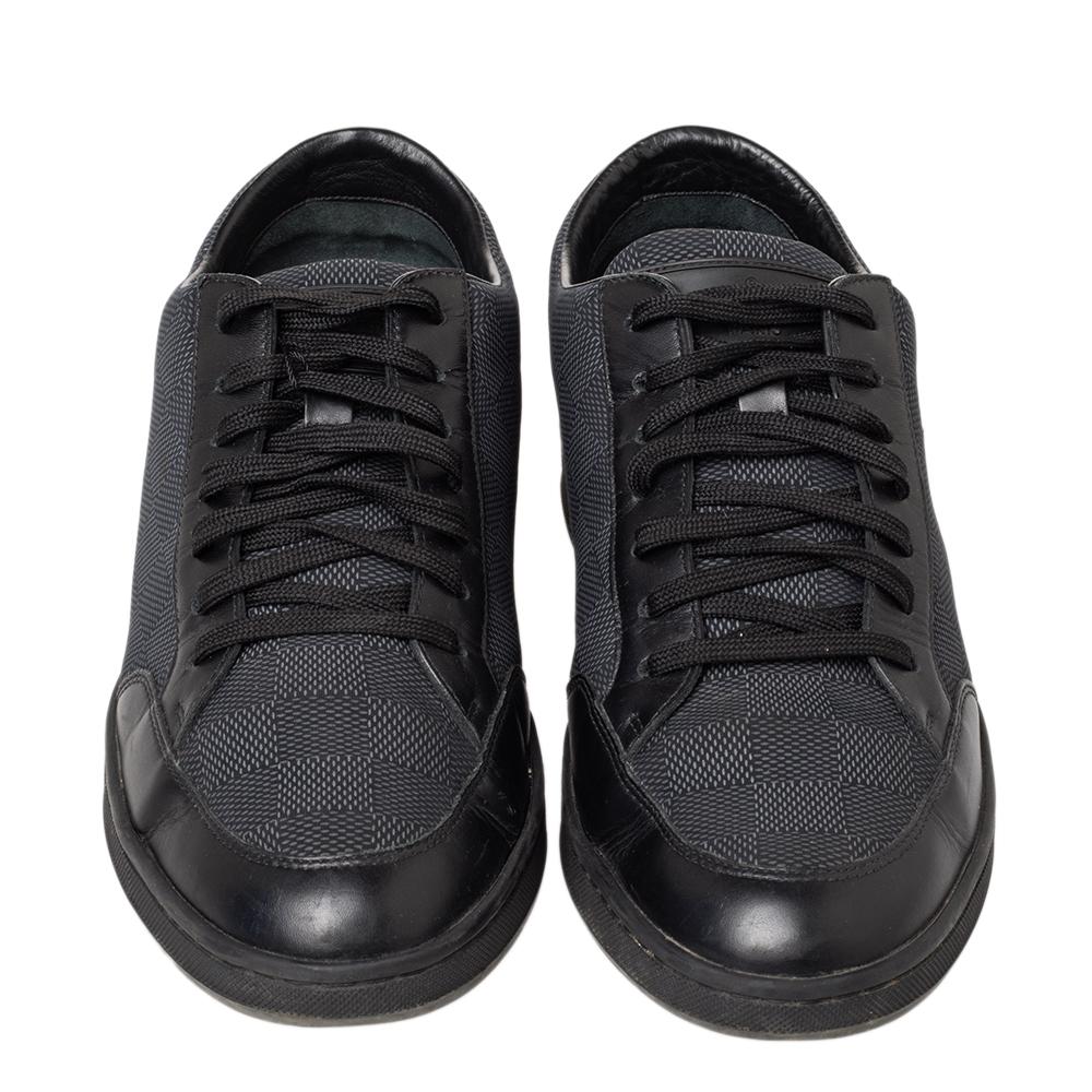 Lightweight, durable and stylish, these sneakers from the house of Louis Vuitton are designed in Graphite Damier fabric and completed with leather trims. The pair features lace-up fronts and is designed to deliver style and functionality. The pair