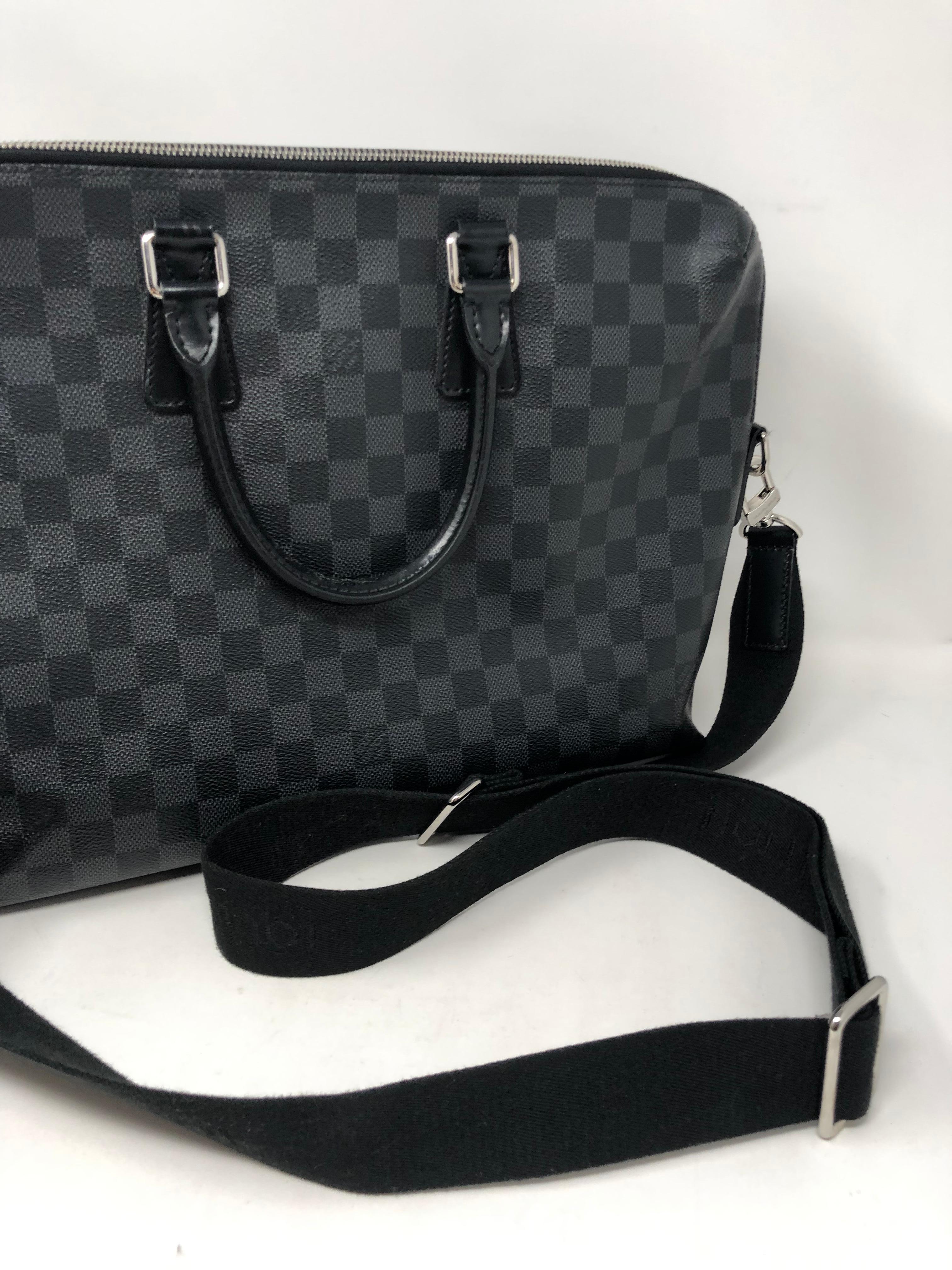 Louis Vuitton Graphite Messenger Bag. Great for a laptop holder or case. Black and grey checkered design LV. Includes detachable strap that is also adjustable. Great condition. Guaranteed authentic. 