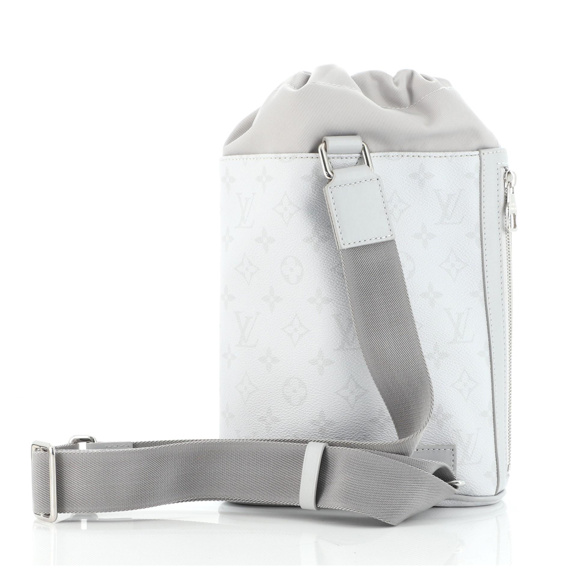 Louis Vuitton White Grey Leather Chalk Sling Bag features gray Monogram coated canvas and multicolor print, gray fabric interior, drawstring closure on top, adjustable strap, external side pocket with zipper and silver-tone hardware.

 

63641MSC
