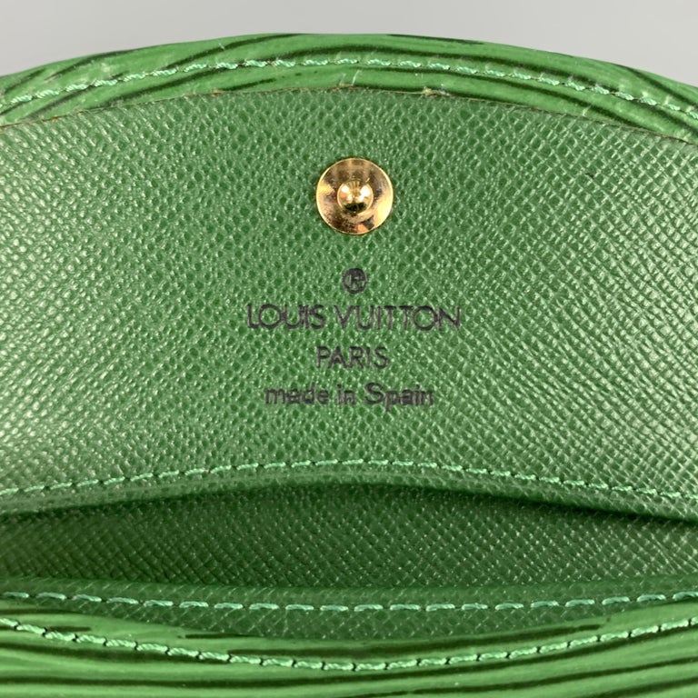 Louis Vuitton, Three Louis Vuitton Epi Leather articles including a yellow cosmetics  pouch, a green pencil case and a green key holder