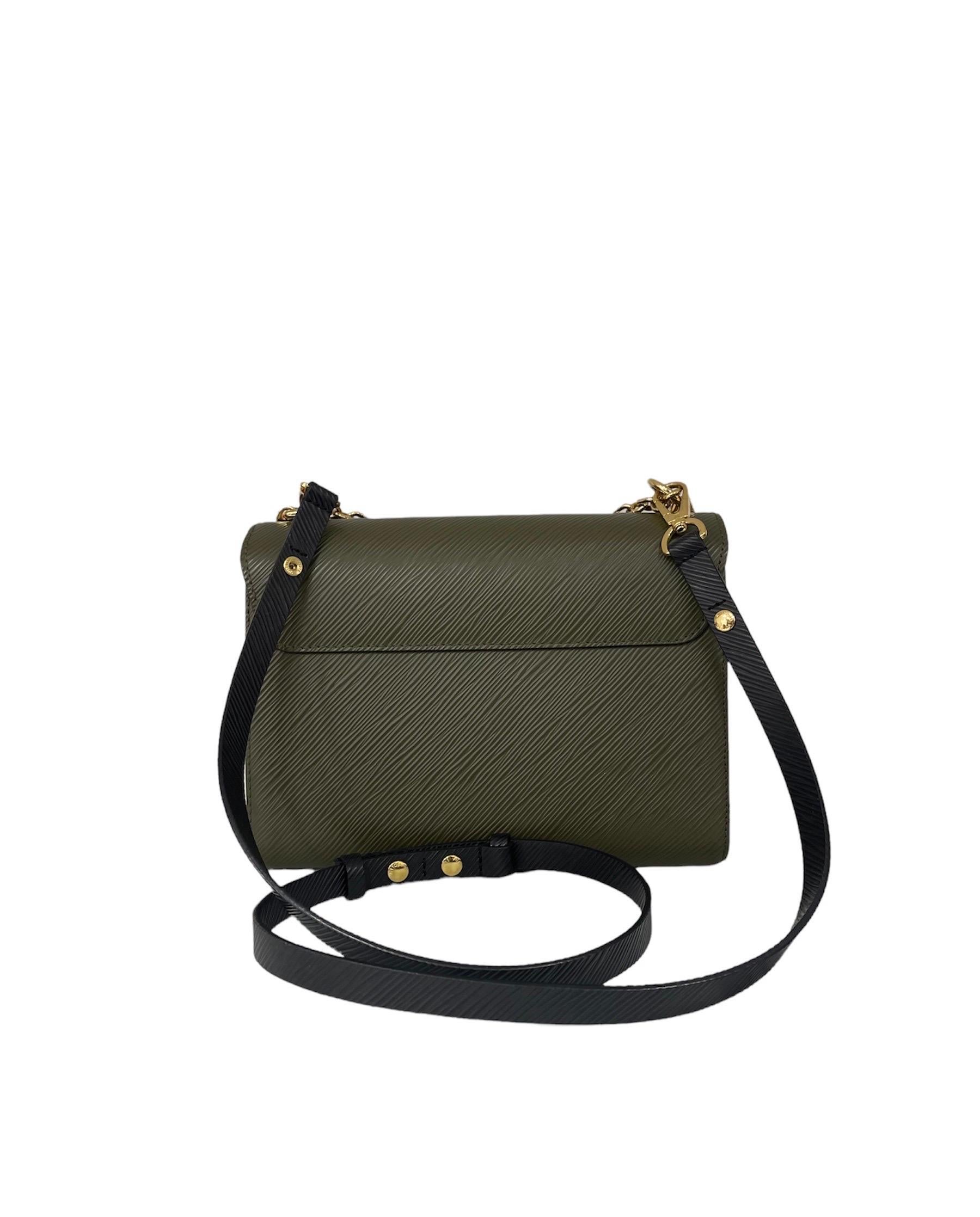 Louis Vuitton signierte Tasche, Twist Modell, Größe MM, aus militärischem grünem epi-Leder mit seitlichen Schreibtischen und goldenen Beschlägen. 
Ausgestattet mit einem Klappenverschluss mit Ineinandergreifen, innen mit schwarzem Wildleder