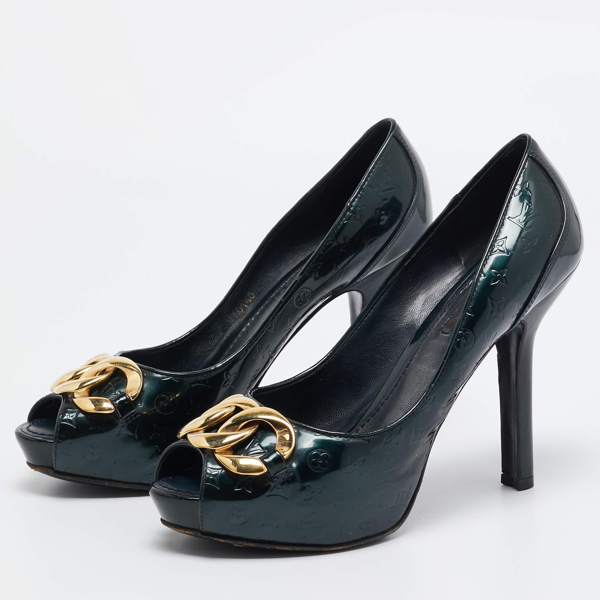 Brought to you from the House of Louis Vuitton these pumps will luxuriously revamp our outfit. With the green Monogram patent leather used on the exterior and delicate gold toned chain detailing on the upper these LV pumps are all about making a