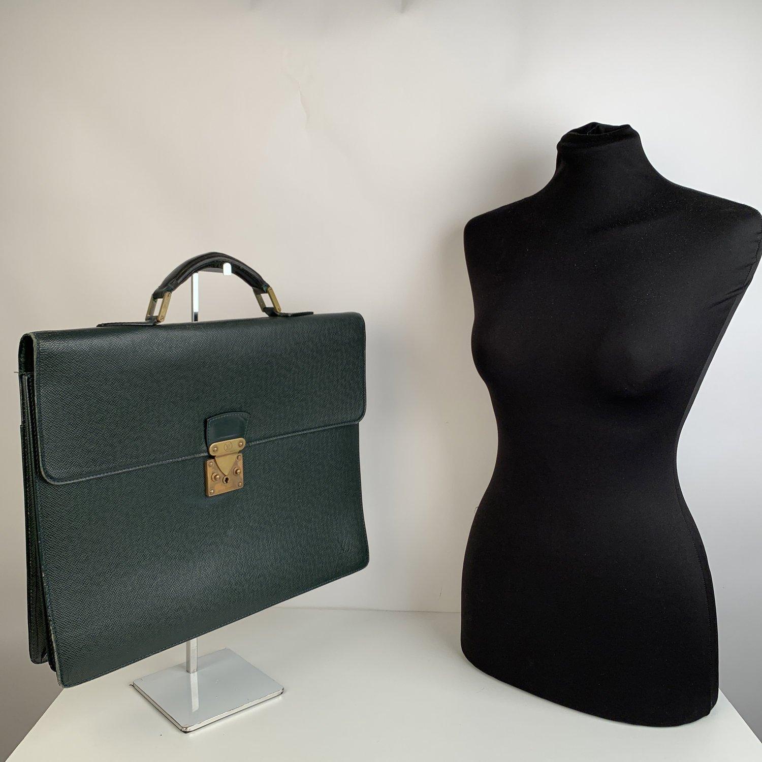 MATERIAL: Leather COLOR: Green MODEL: Briefcase GENDER: Women, Men SIZE: Large Condition B - VERY GOOD Gently used. Some normal wear of use on the hardware. Some wear of use on leather handle. Some wear of use on bottom corners, Some scratches on