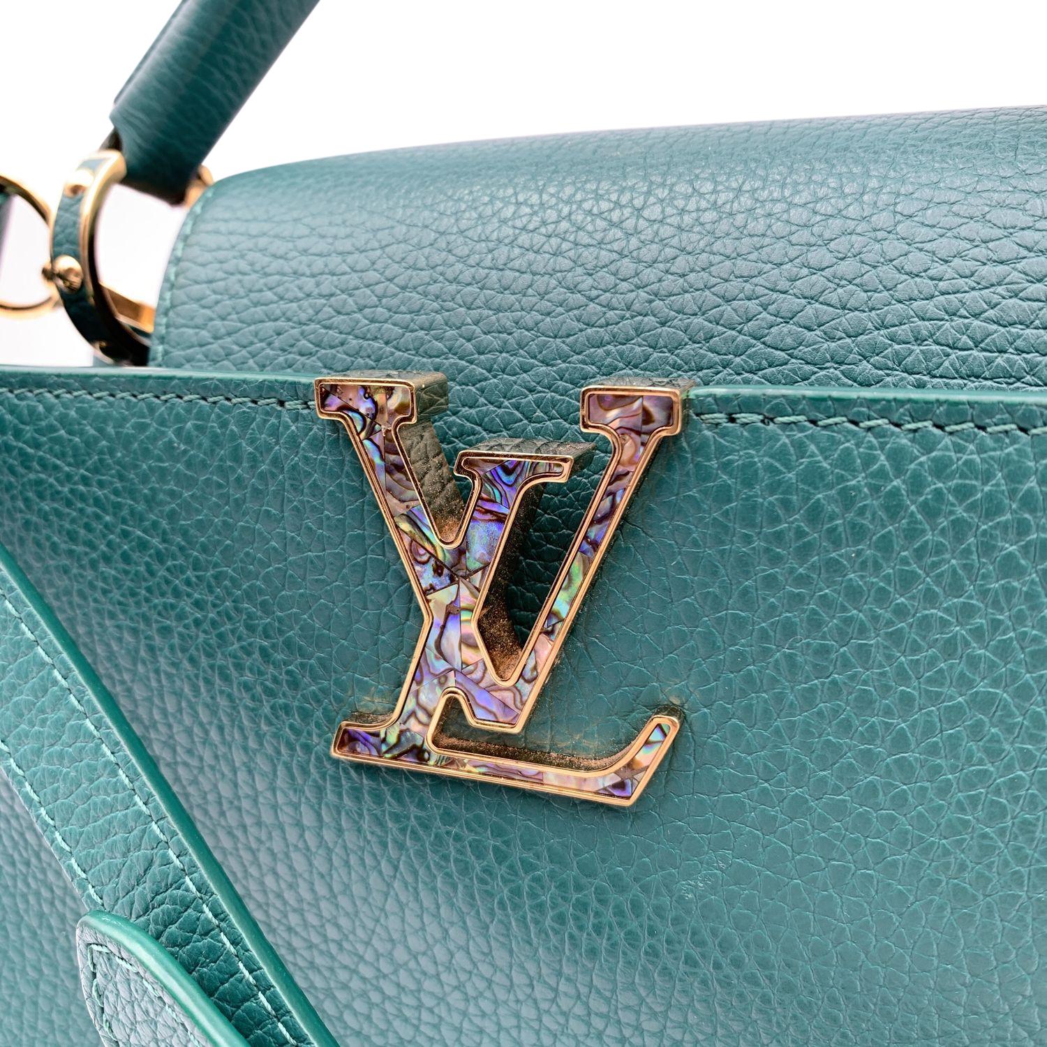 This beautiful Bag will come with a Certificate of Authenticity provided by Entrupy. The certificate will be provided at no further cost.

Beautiful Louis Vuitton Capucines PM handbag in Green Taurillon leather. Gold metal hardware. LV initials on