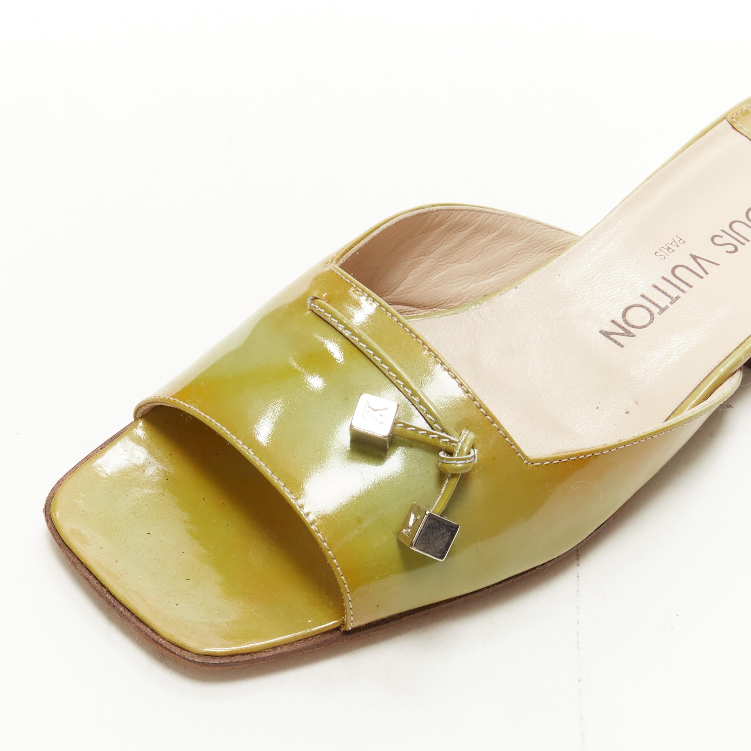 LOUIS VUITTON green yellow polished leather LV dice square toe slipper EU37
Brand: Louis Vuitton
Material: Leather
Color: Green
Pattern: Solid
Made in: Italy

CONDITION:
Condition: Fair, this item was pre-owned and is in fair condition. Please refer