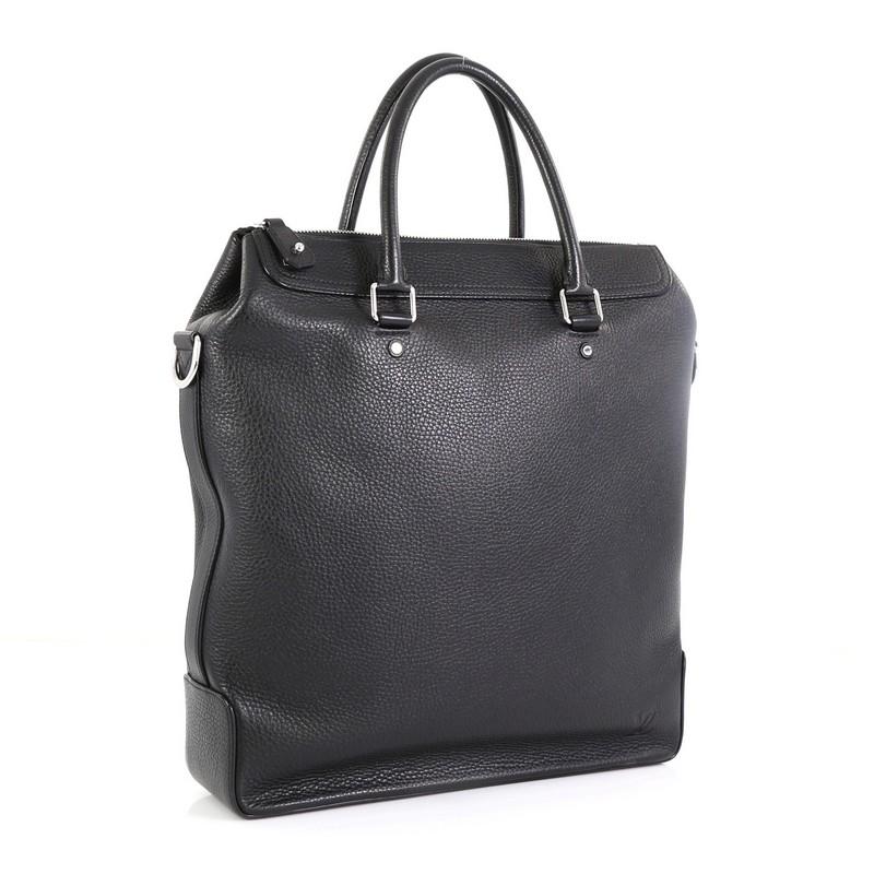 This Louis Vuitton Greenwich Tote Taurillon Leather, crafted in black leather, features dual-rolled leather handles, and silver-tone hardware. Its zip closure opens to a black microfiber interior with zip and slip pockets. Authenticity code reads: