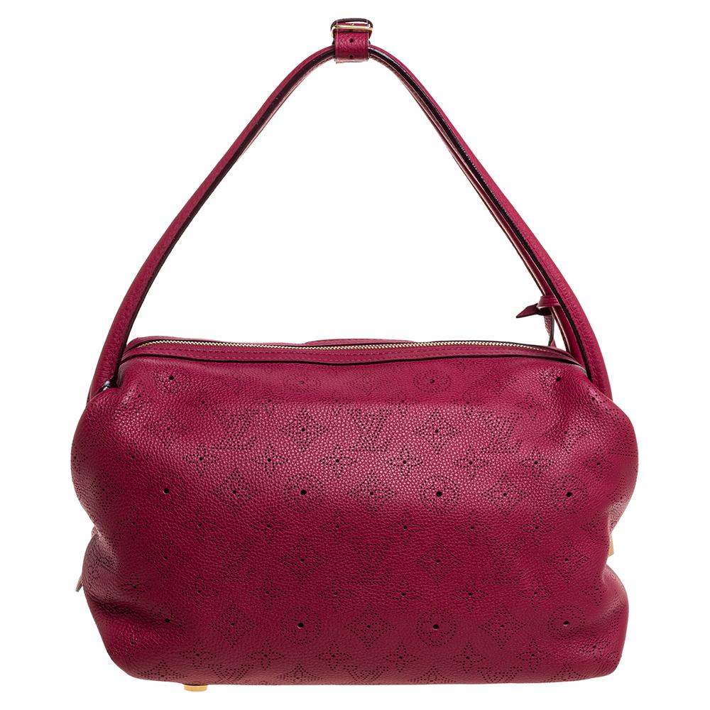 Louis Vuitton's Galatea bag comes with a unique shape. Made in France, the bag is made from perforated monogram leather and comes with a roomy interior and gold-tone hardware. It also has a leather clochette to the side. Lift your outfits by teaming