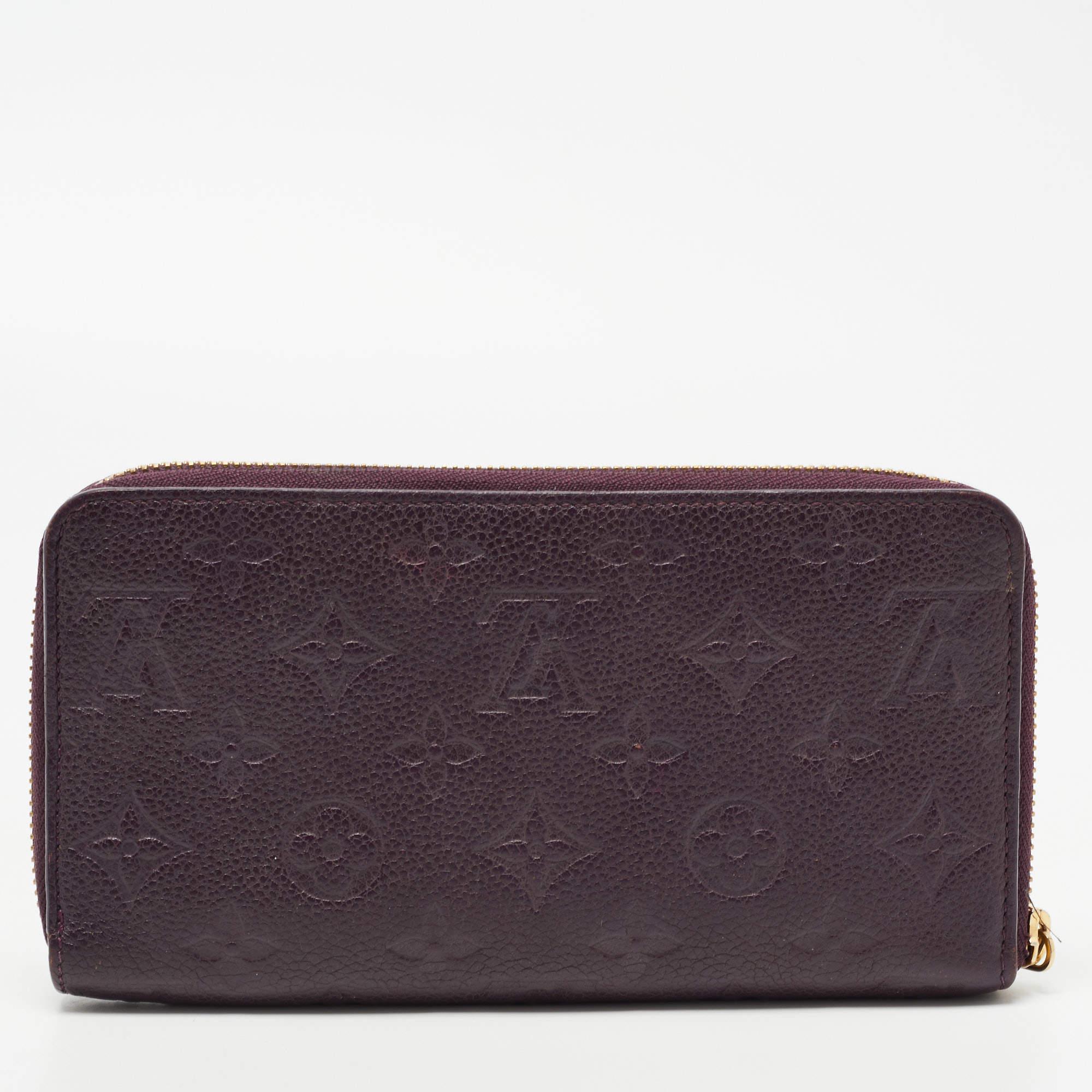 This Louis Vuitton Zippy wallet is conveniently designed for everyday use. Crafted from Monogram Empreinte leather, the wallet has a wide zip closure that opens to reveal multiple slots, lined compartments, and a zip pocket for you to arrange your