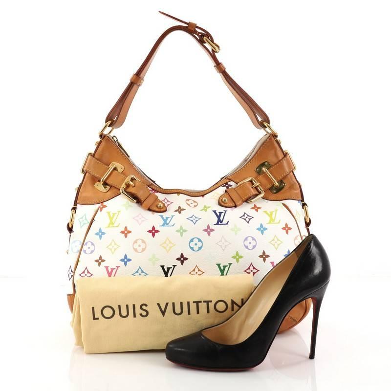 This authentic Louis Vuitton Greta Handbag Monogram Multicolor makes a perfect city bag. Crafted from white monogram multicolor coated canvas, this sleek bag features adjustable leather shoulder strap, buckle detailing with natural leather trim all