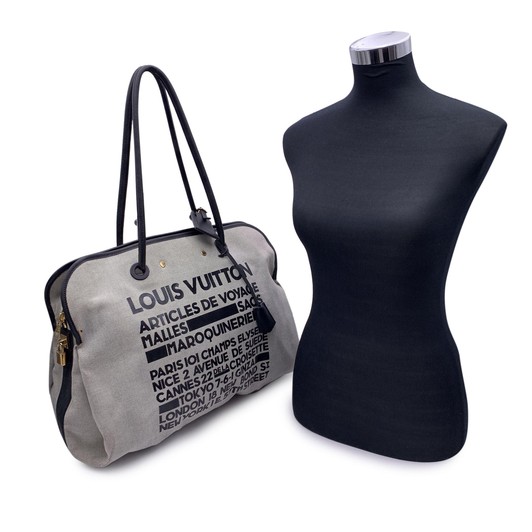 Limited edition Louis Vuitton 'Articles De Voyage' large tote bag, crafted from canvas with black leather print. Genuine leather trim and handles. Gold metal hardware. Upper zipper closure. Patch pocket on the back. White monogram lining. 2 side