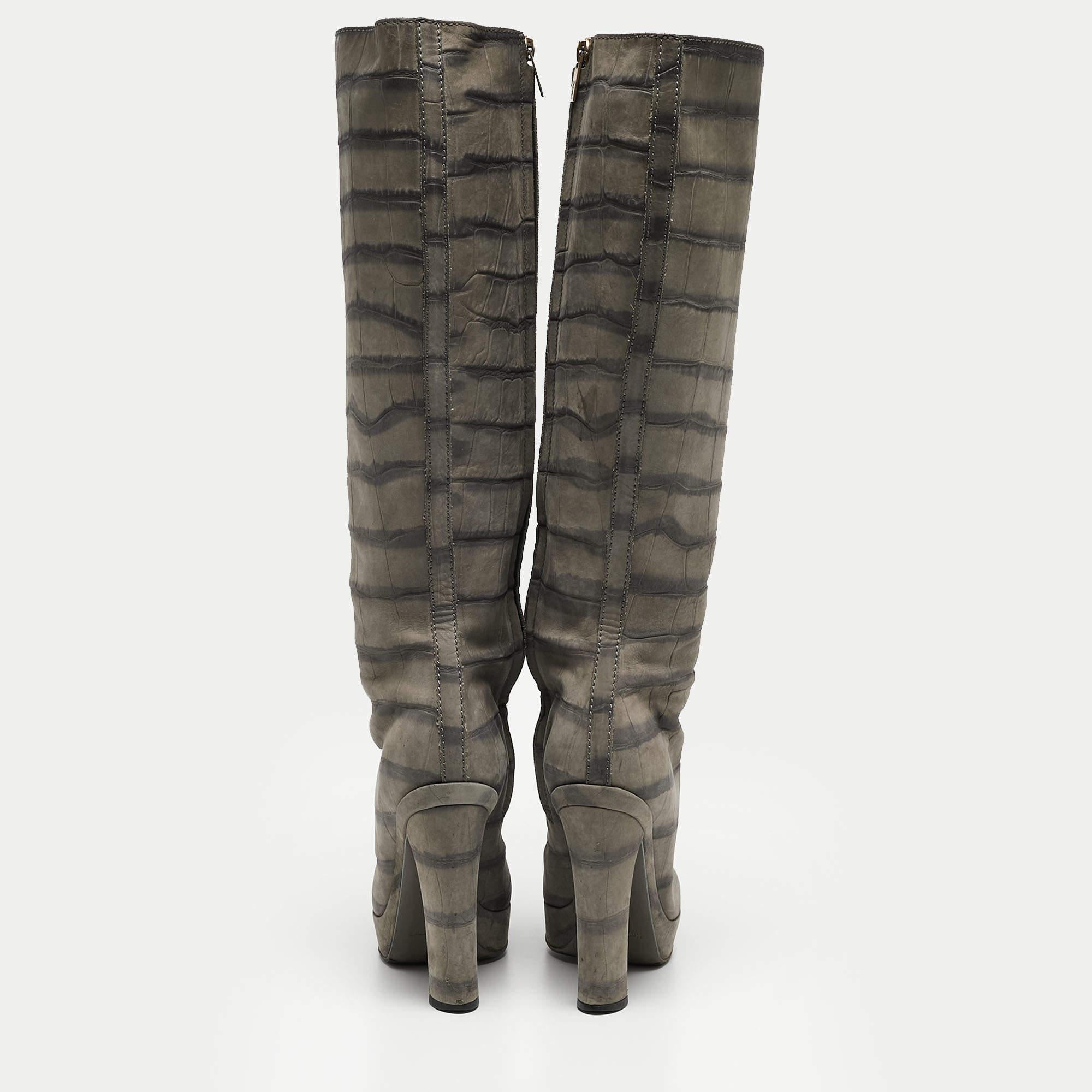 You are sure to make heads turn every time you wear these chic knee-length boots from Louis Vuitton! The grey boots have been crafted from croc-embossed leather. This is one pair you definitely need to get your hands on!

Includes: Original Dustbag