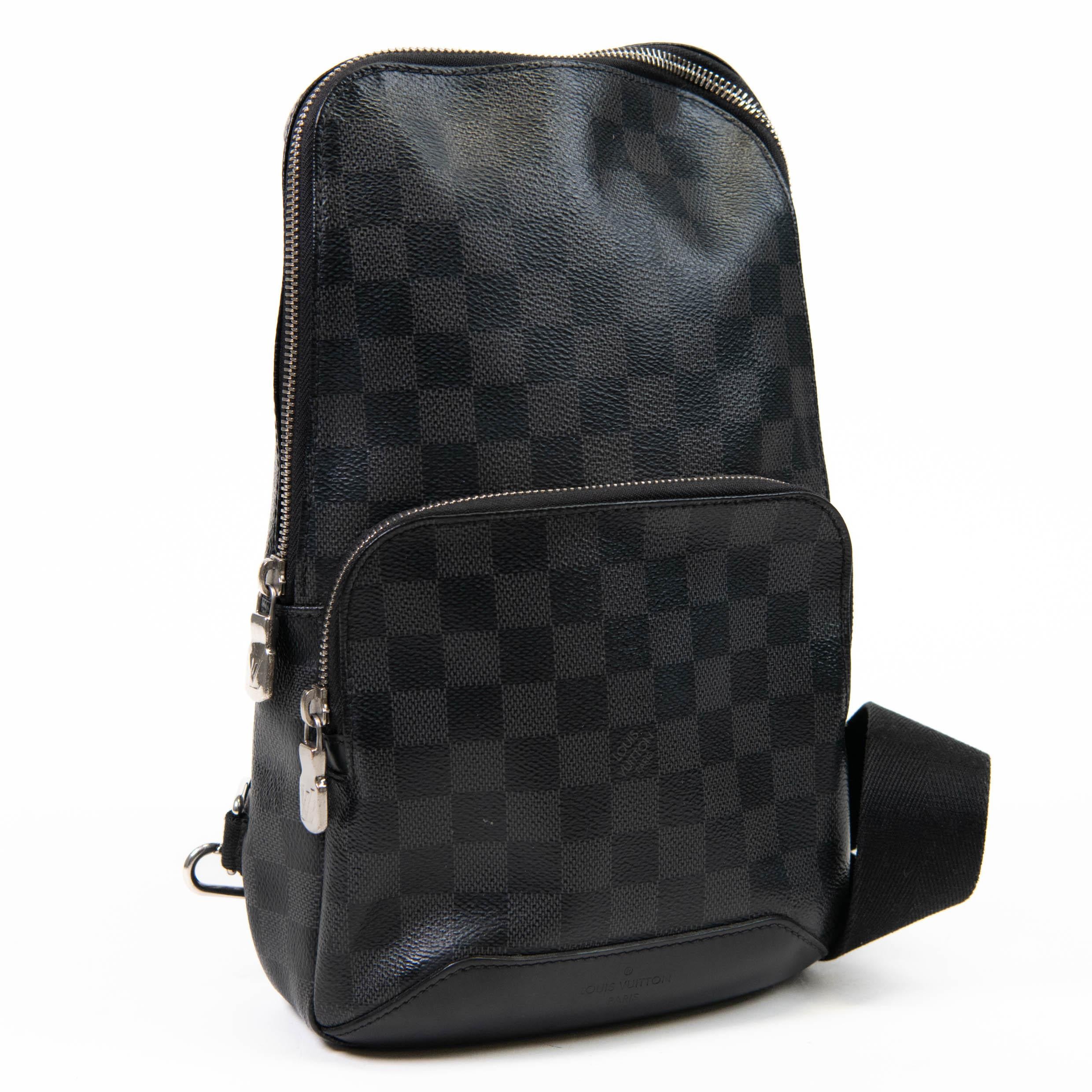 100% Authentic

This stylish backpack is crafted of Louis Vuitton's signature Damier coated canvas in black and gray. This bag features a small zipped pocket on the front, an adjustable black canvas shoulder strap, and a silver wrap-around zipper