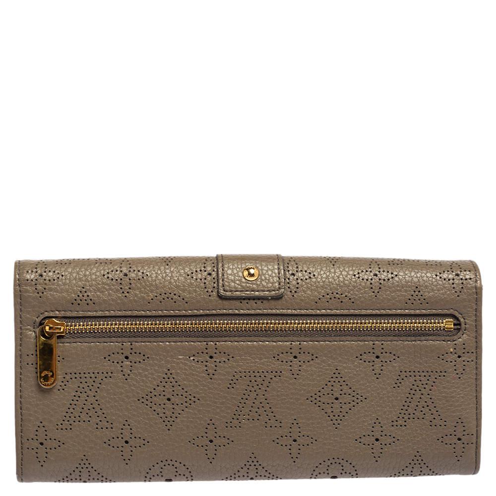 Made from premium monogram Mahina leather, this wallet is a long-lasting accessory. Store your daily essentials and put together a stylish look with this wallet from Louis Vuitton. Featuring a rich shade, this superb wallet will last you many