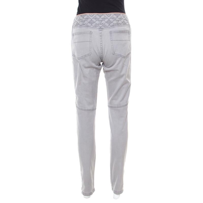 Featuring a quilted pattern near the waist accented with monogram embroidery, these denim jeans from Louis Vuitton are finely crafted with a cotton blend and are designed in a grey hue with hints of stretch. Wear these to inject a comfortable feel