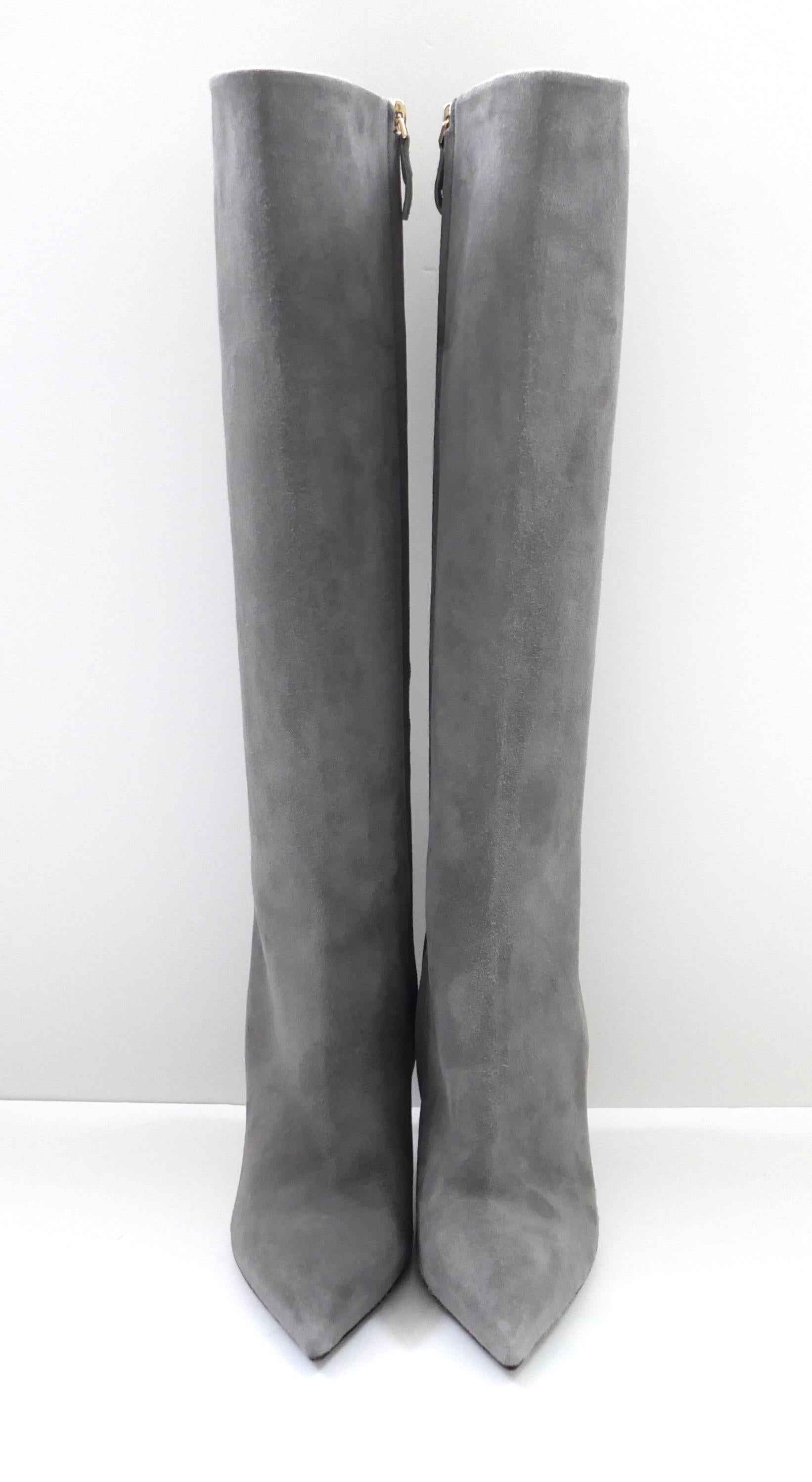 Totally gorgeous Louis Vuttion boots - unworn. Made from soft grey suede with goldtone Louis Vuitton heel plaques. They have a classic knee high shape with pointed toes, stiletto heels and zip to inner side. Size 38.5 Measure approx - sole 11”, heel
