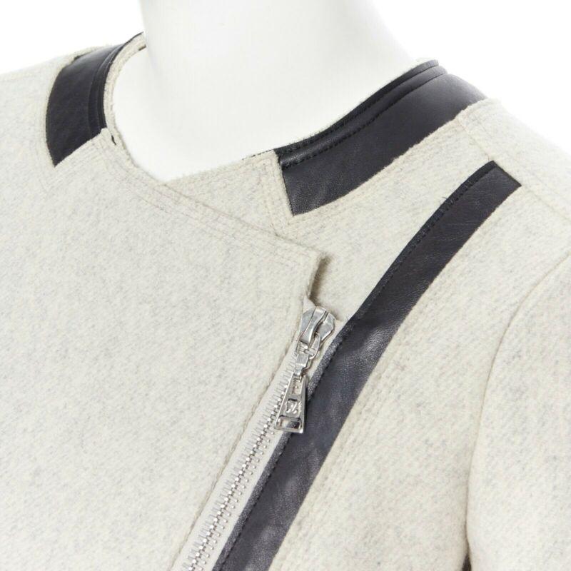 LOUIS VUITTON grey wool blend cashmere lambskin leather panels biker jacket FR36
Reference: CC/KWGG00287
Brand: Louis Vuitton
Material: Wool
Color: Grey
Pattern: Solid
Closure: Zip
Extra Details: Biker style jacket. Zipper fastenings on the left and