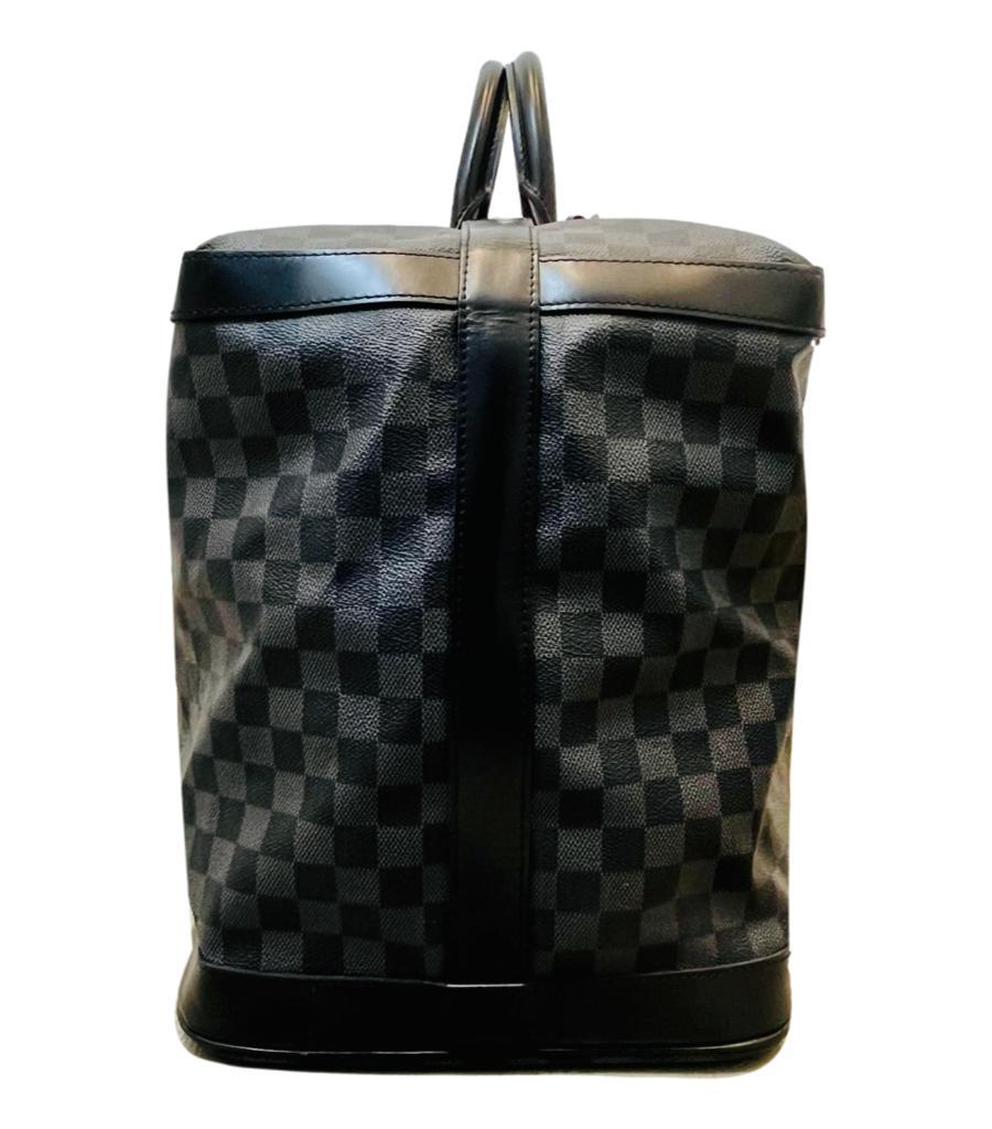 Louis Vuitton Grimaud Damier Travel Bag

Coated canvas bag In dark grey and black signature Damier check pattern.

Black leather accents and silver hardware. 'LV' padlock and keys.

Size - Height 42cm , Width 62cm, Depth 26cm

Condition - Very