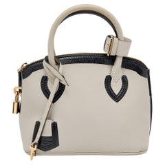 Sac Louis Vuitton modèle Obsession Lockit BB en cuir gris