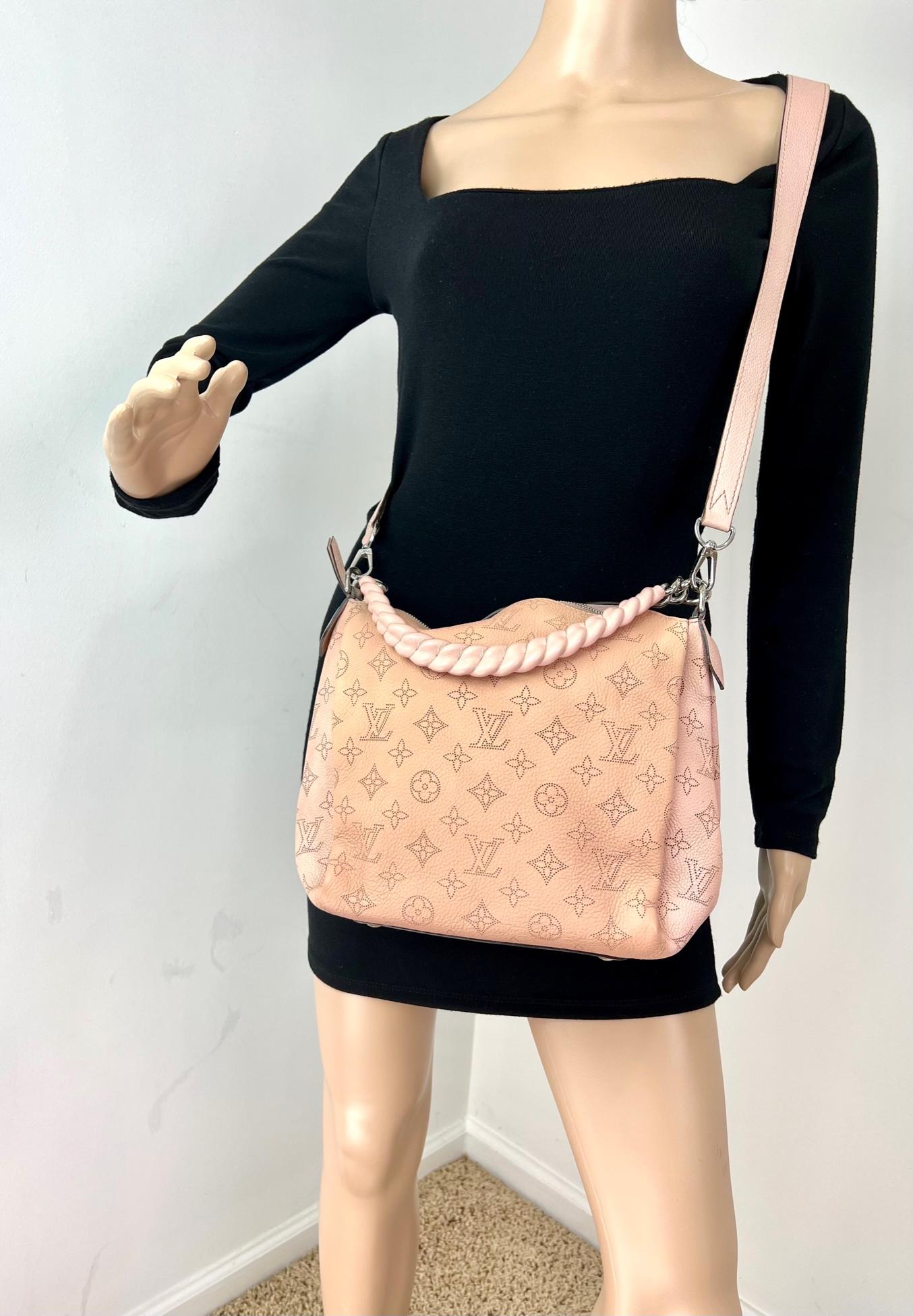 Pre-Owned  100% Authentic
LOUIS VUITTON Babylone Chain BB Mahina
Magnolia Shoulder Bag W/Silver Hardware
RATING: B...Very Good, well maintained,
shows minor signs of wear
MATERIAL: perforated Monogram Mahina Leather
STRAP: LV Removable Pink Leather