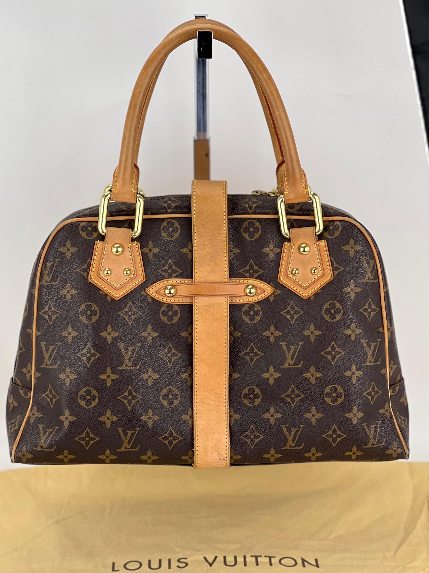 Pre-Owned  100% Authentic
LOUIS VUITTON Manhattan GM Monogram
Hand Bag W/Added Insert to help Organize
and Keep Bag Shape
RATING: B/C... Good, shows signs of regular use
MATERIAL: monogram canvas, leather trim
LEATHER: strap , trim and piping have