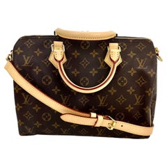 LOUIS VUITTON Speedy 30 Bandouliere-Handtasche mit Monogramm und Nieten  einfügen.