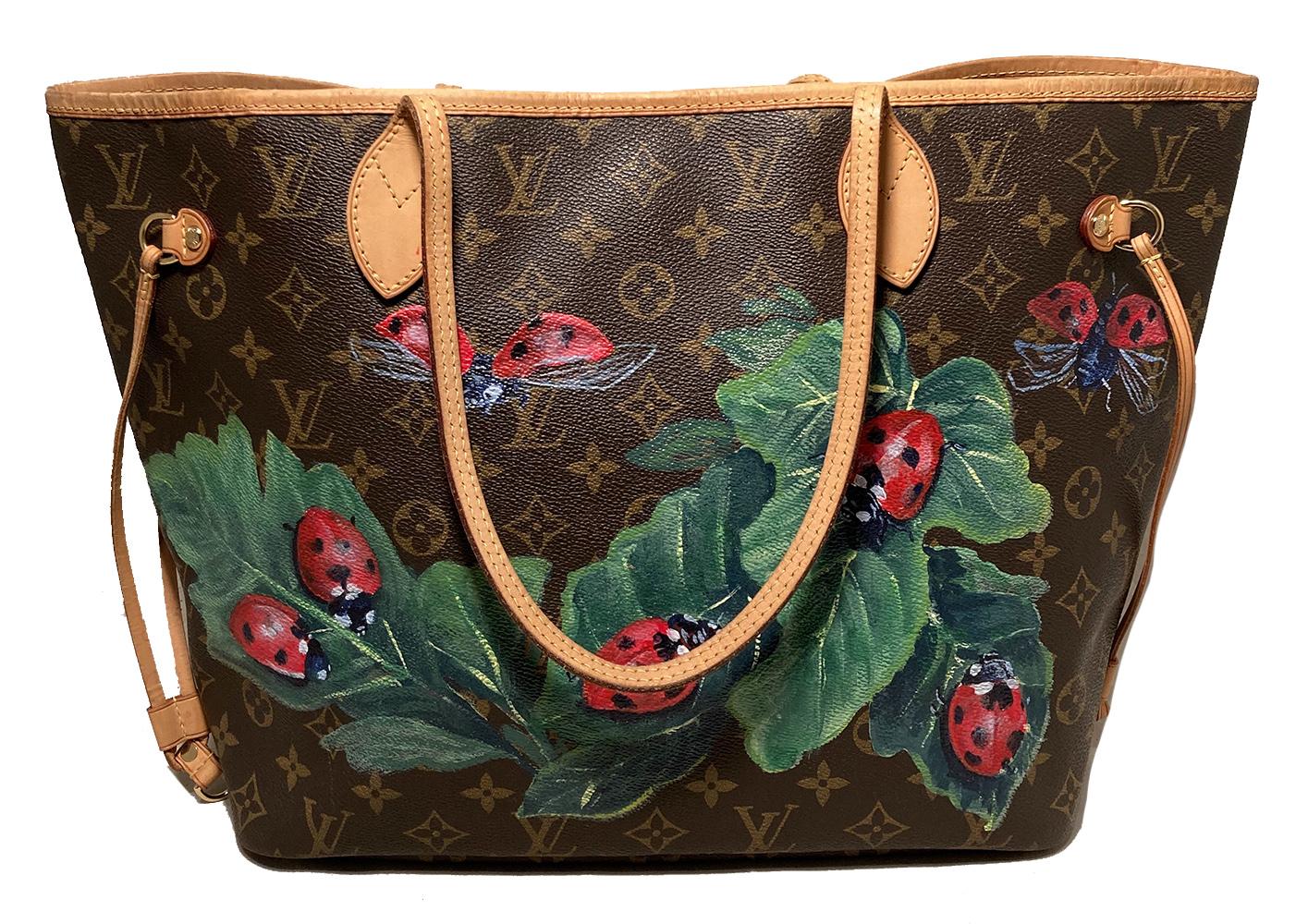 Louis Vuitton Hand Painted Ladybug Neverfull MM Tote in very good condition. Signature monogram canvas exterior with red ladybugs upon leaves painted along front and backsides. Tan leather trim and brass hardware. Top spring ring closure opens to a