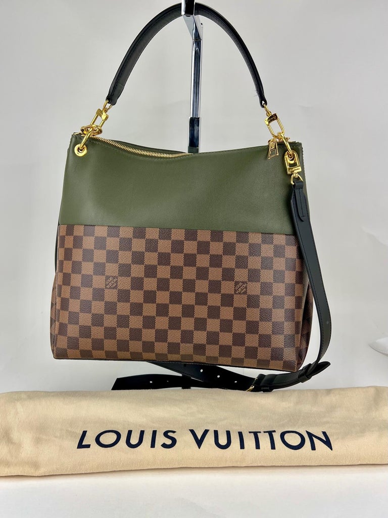 Pre-Owned  100% Authentic
LOUIS VUITTON Maida Damier Ebene Khaki
Leather Shoulder Hand Bag  W/Added Insert
to Help Organize and Keep Bag Shape
RATING: A...excellent, near mint, only
slight signs of wear
MATERIAL: damier ebene canvas, taurillon
