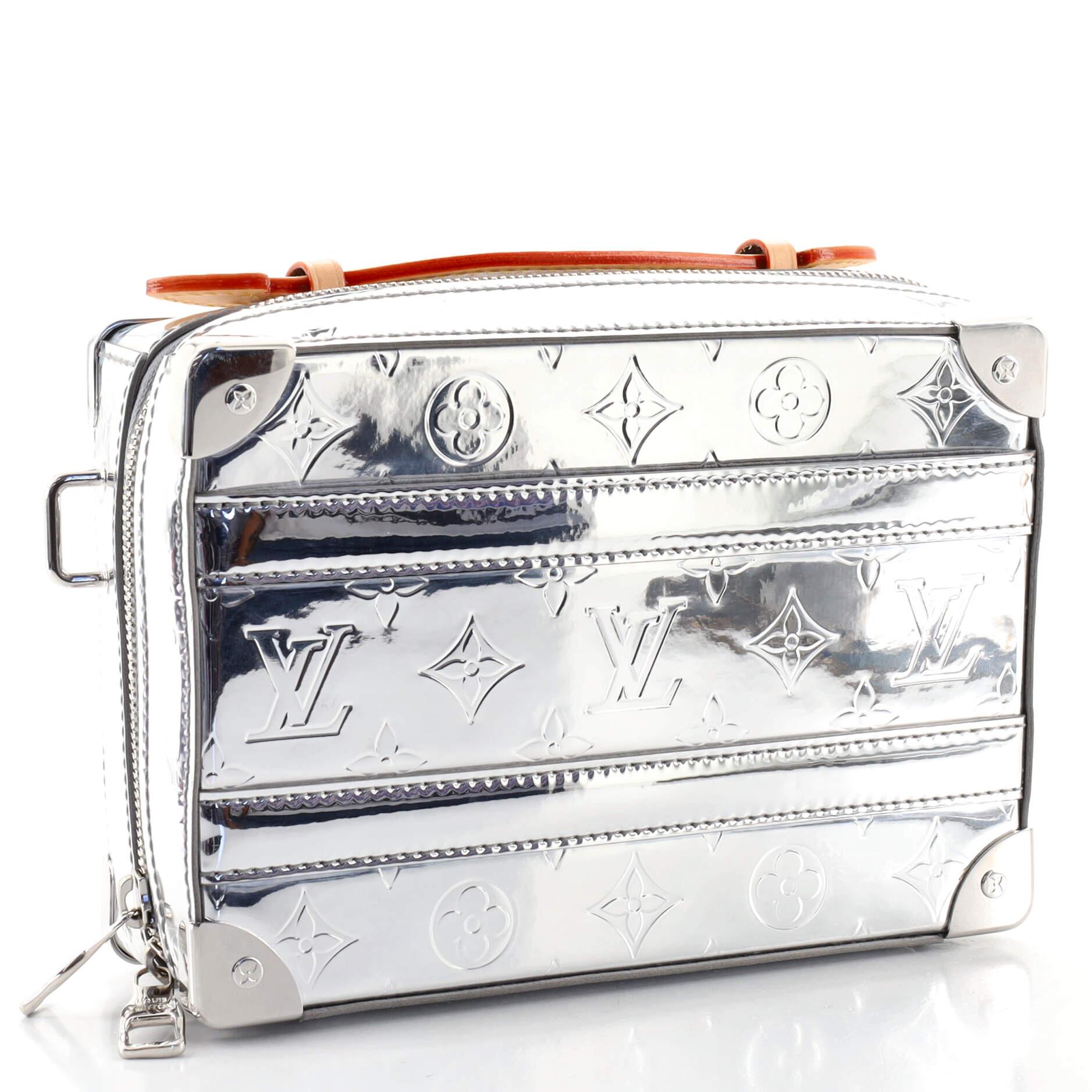 Condition: Very good. Scuffs and marks on exterior, watermarks, wear, minor scuffs and darkening on leather trims, handle and strap. Light wear and marks in interior, scratches on hardware.
Accessories: No Accessories
Measurements: Handle Drop 1