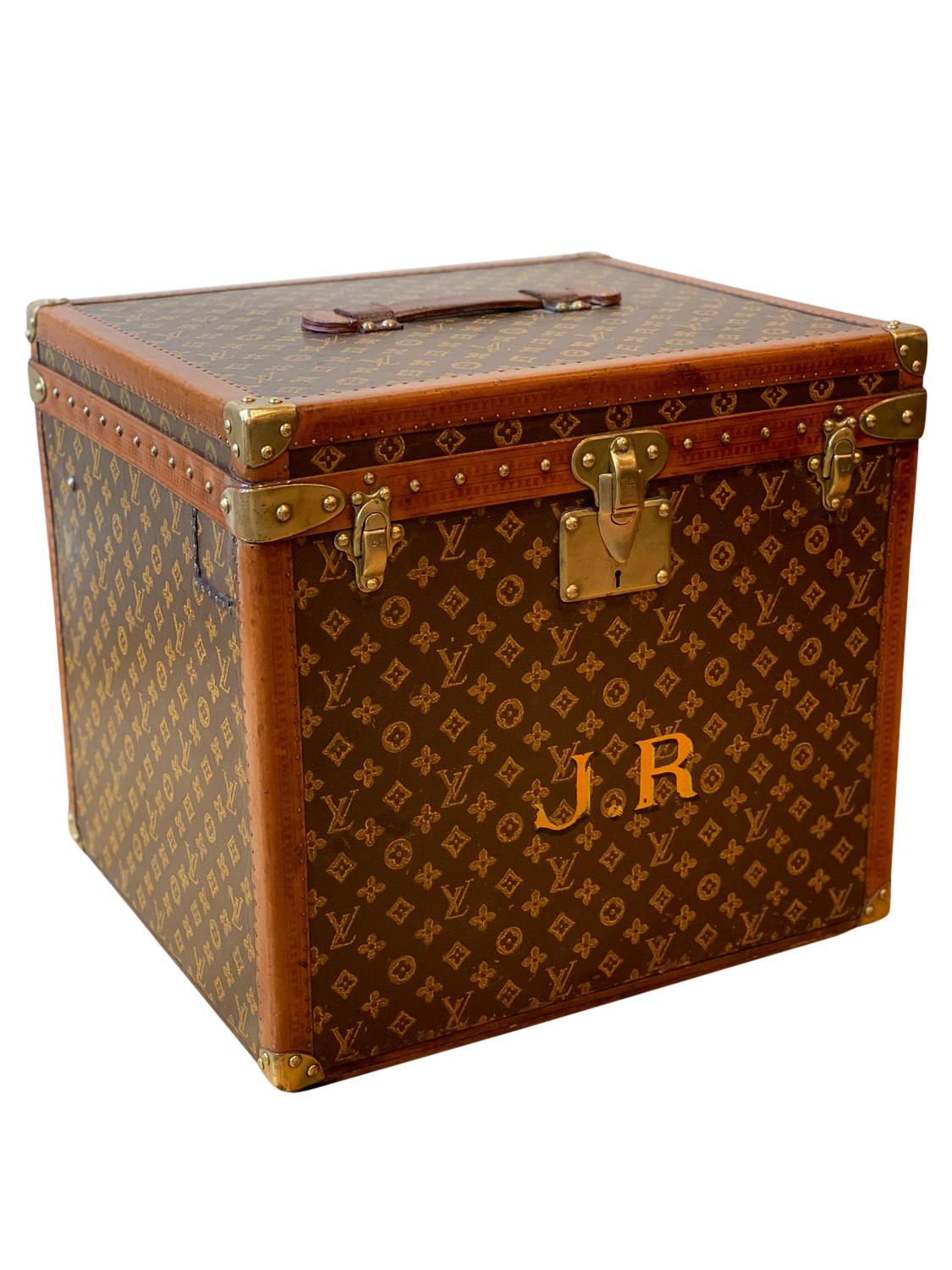 A Louis Vuitton Hatbox, circa 1930, in monogrammed canvas with the initials J.R. front and centre. The condition of the hatbox is excellent with all original hardware and leather handle. Louis Vuitton worried about his clients and their hats on both