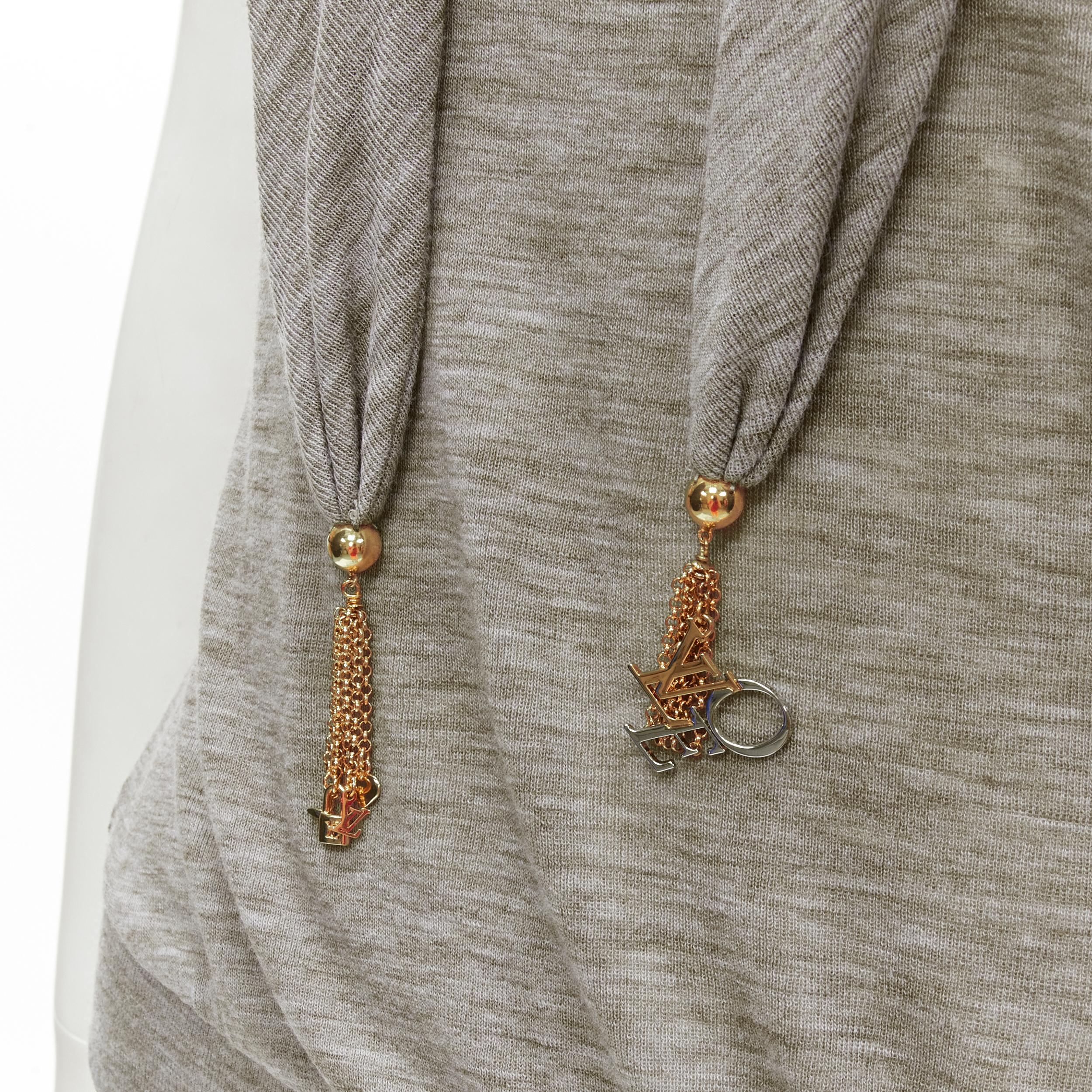 LOUIS VUITTON heather grey LVOE tassel charm scarf collar pullover top  S
Brand: Louis Vuitton
Designer: Marc Jacobs
Collection: LVOE 
Material: Feels like wool
Color: Grey
Pattern: Solid
Extra Detail: V-Neckline with attached scarf. Mixed metal LV