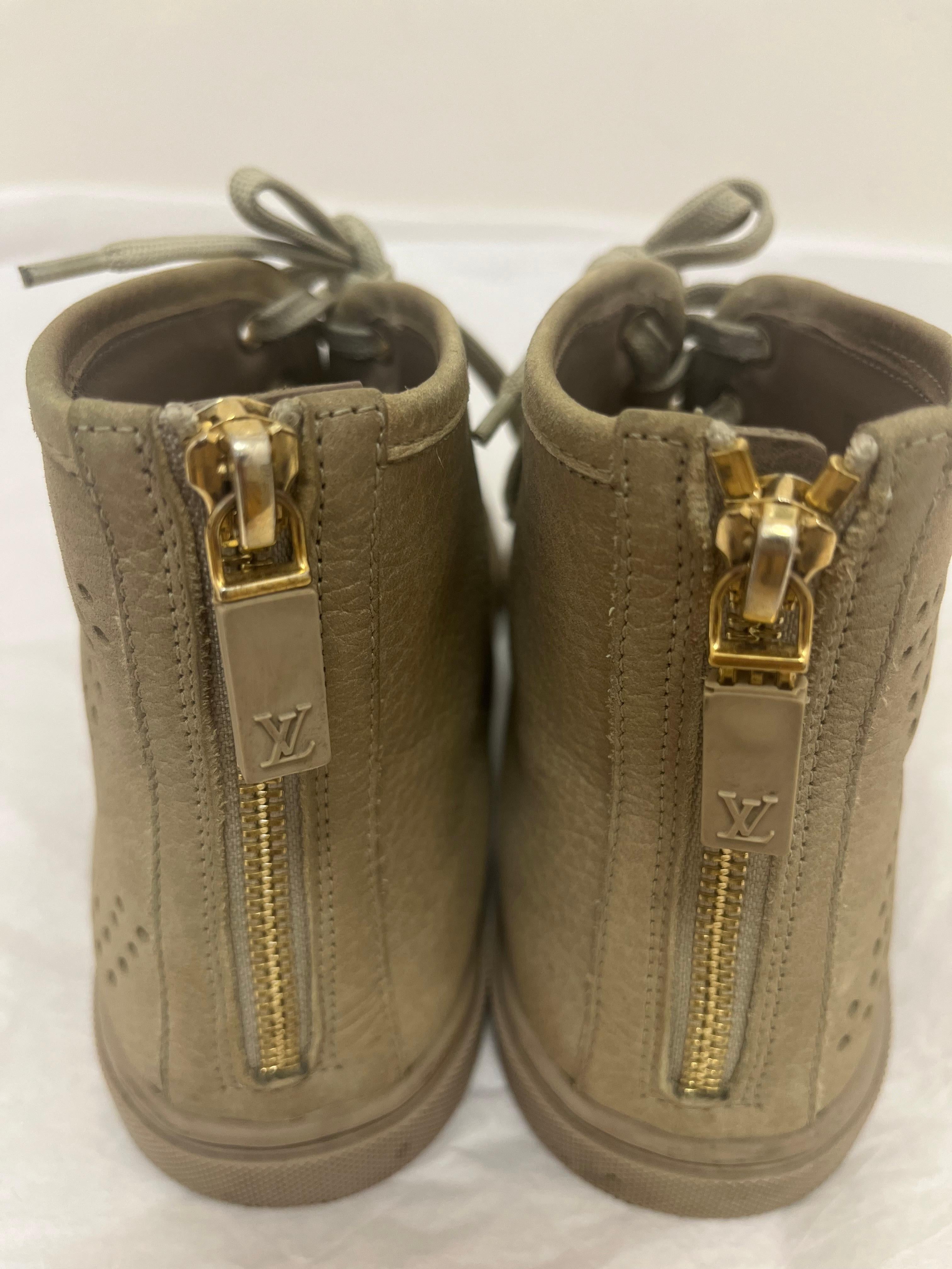 High tops can be worn at any time and with most outfits.
These are Louis Vuitton perforated High tops.
The perforations are on the side and quite visible.
These high tops are made of nubuck leather and are both lace up and have a zipper at the back